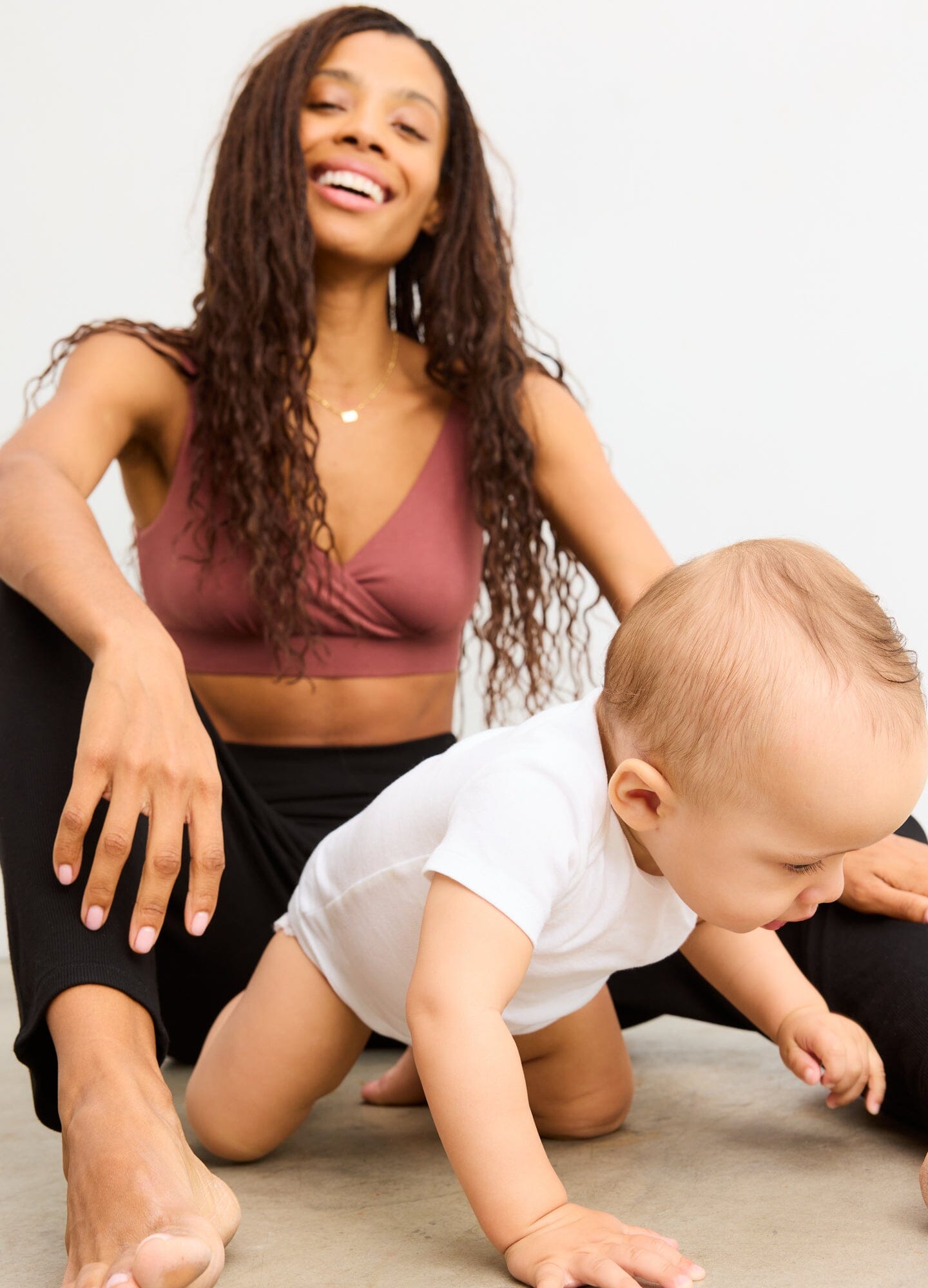 The Dream Feed Nursing And Sleep Bra - Soft, stretchy anise maternity nursing bra with easy-access clips, modeled during postpartum and nursing moments.