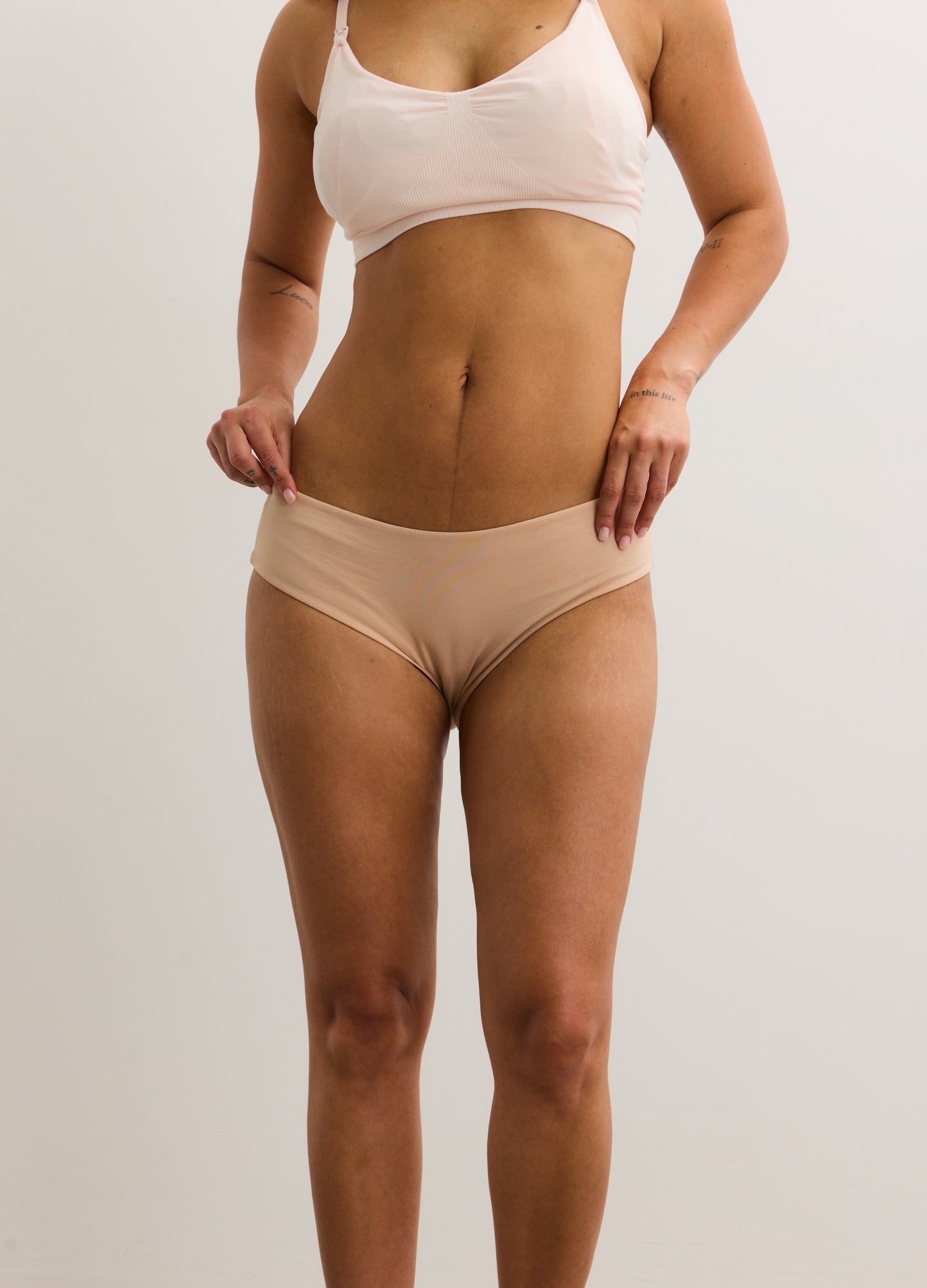 Nude maternity brief with soft, stretchy fabric and a low-rise waist designed for comfort and support.