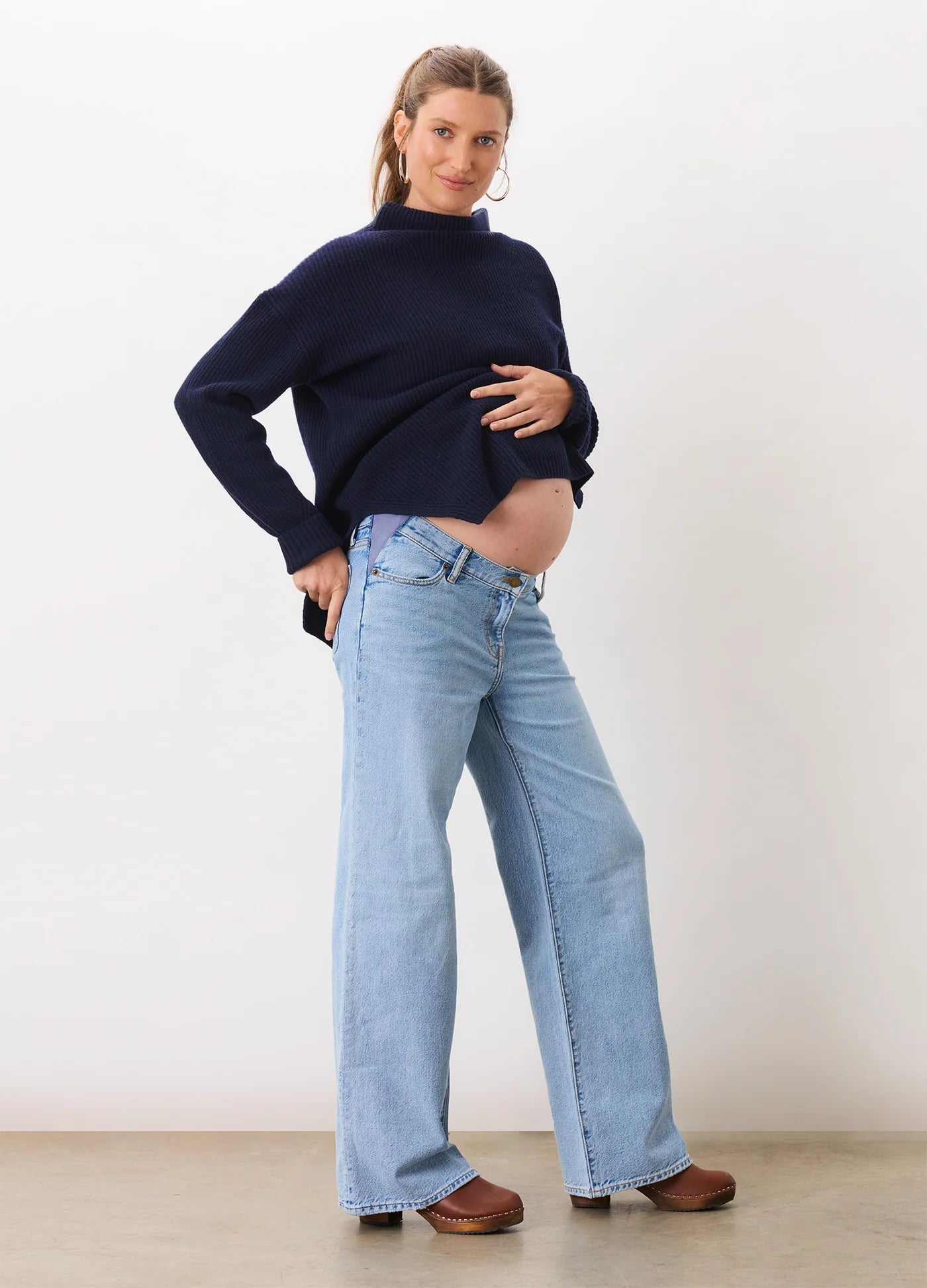 Light blue wide-leg maternity jeans with a relaxed fit and soft denim fabric.