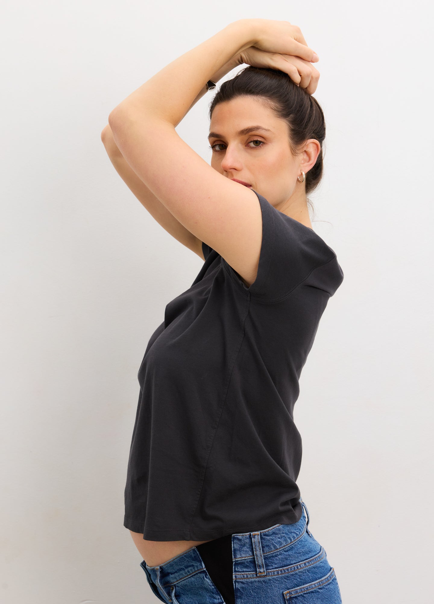 Black washed cotton short sleeve crew neck maternity t-shirt with relaxed fit and soft texture.