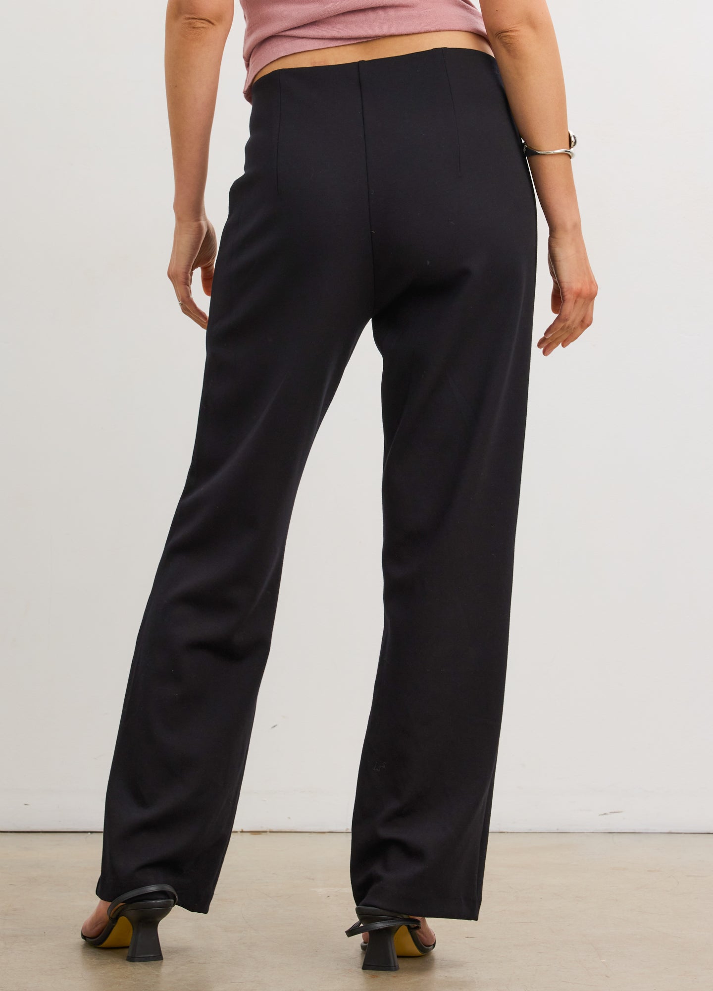 Black stretch straight-leg maternity work pants with seamed detailing and a comfortable fit.