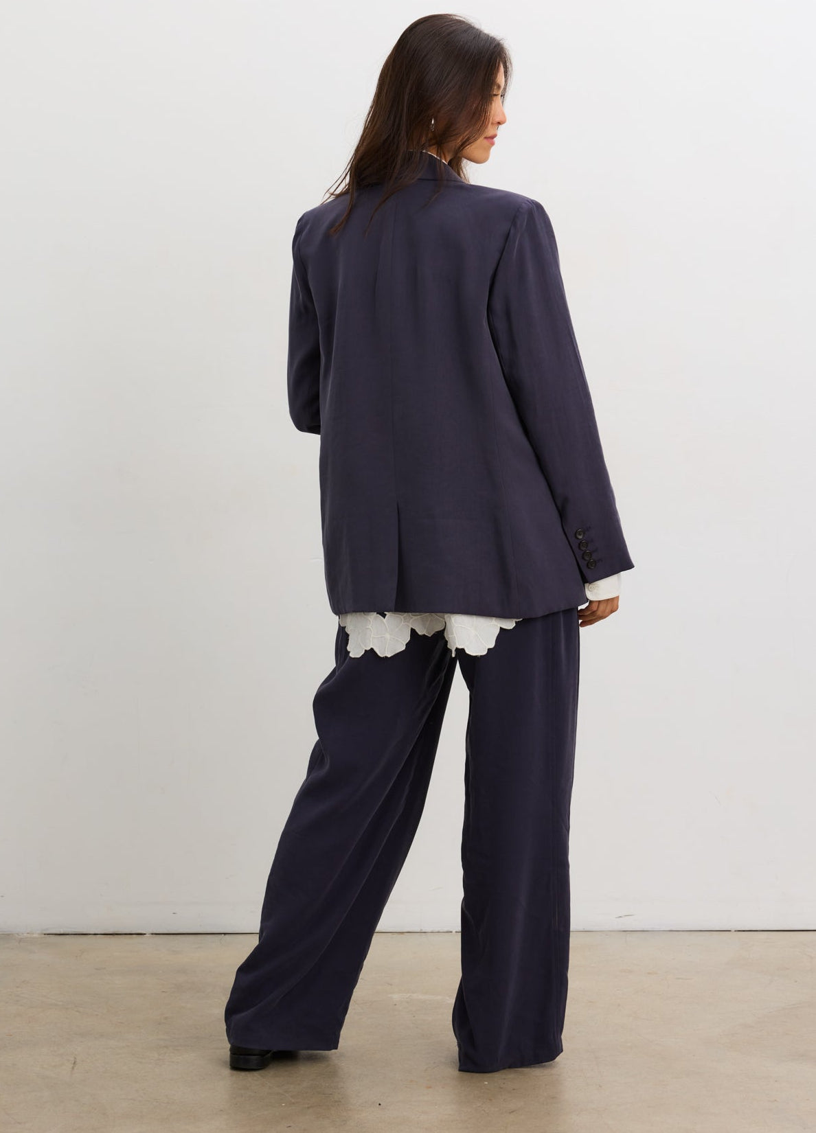 Black soft tailored pull-on maternity trousers with wide legs and a smooth, elastic waistband.