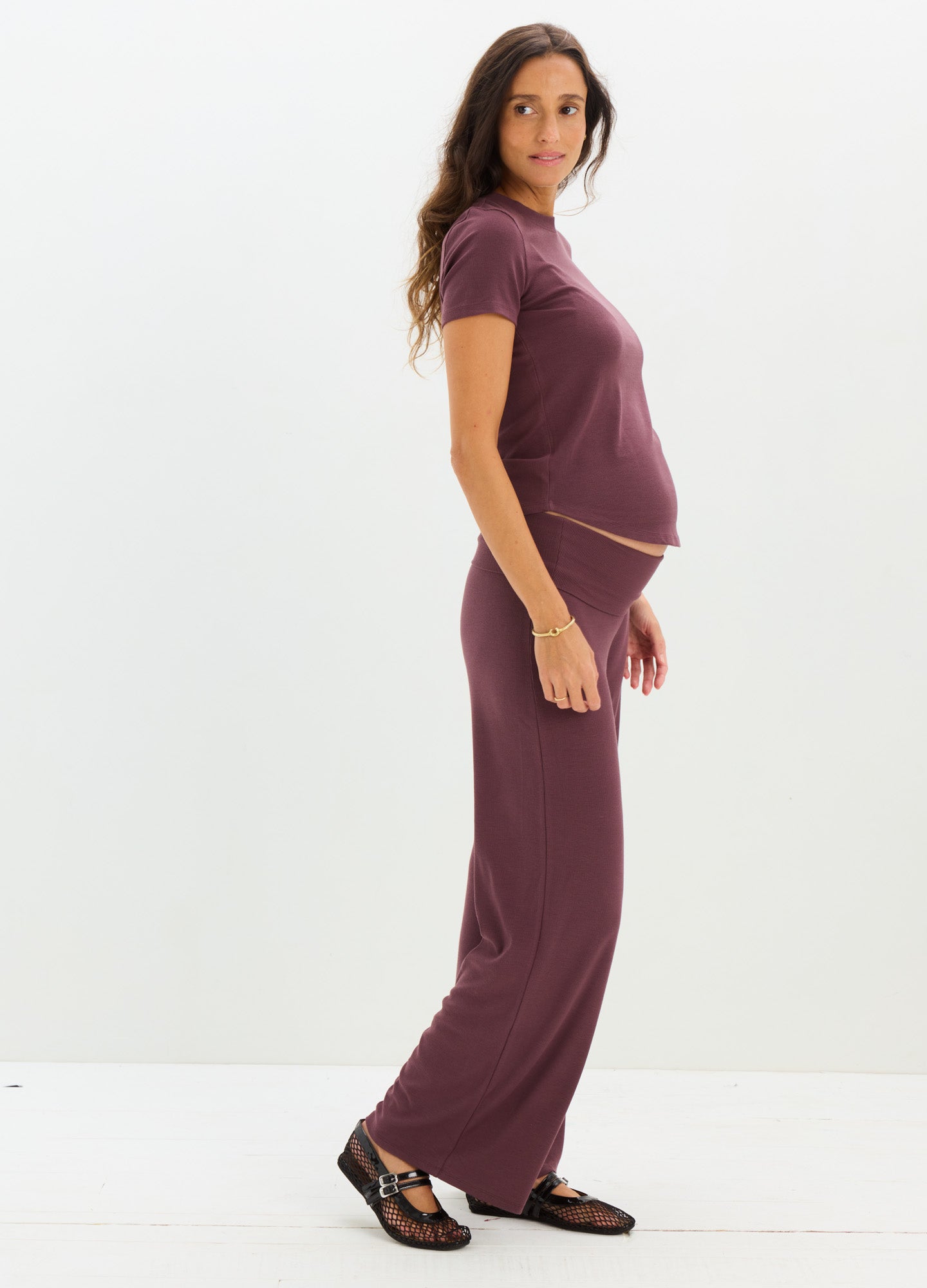 Soft ribbed maternity tee in deep plum with short sleeves and matching flowy pants.