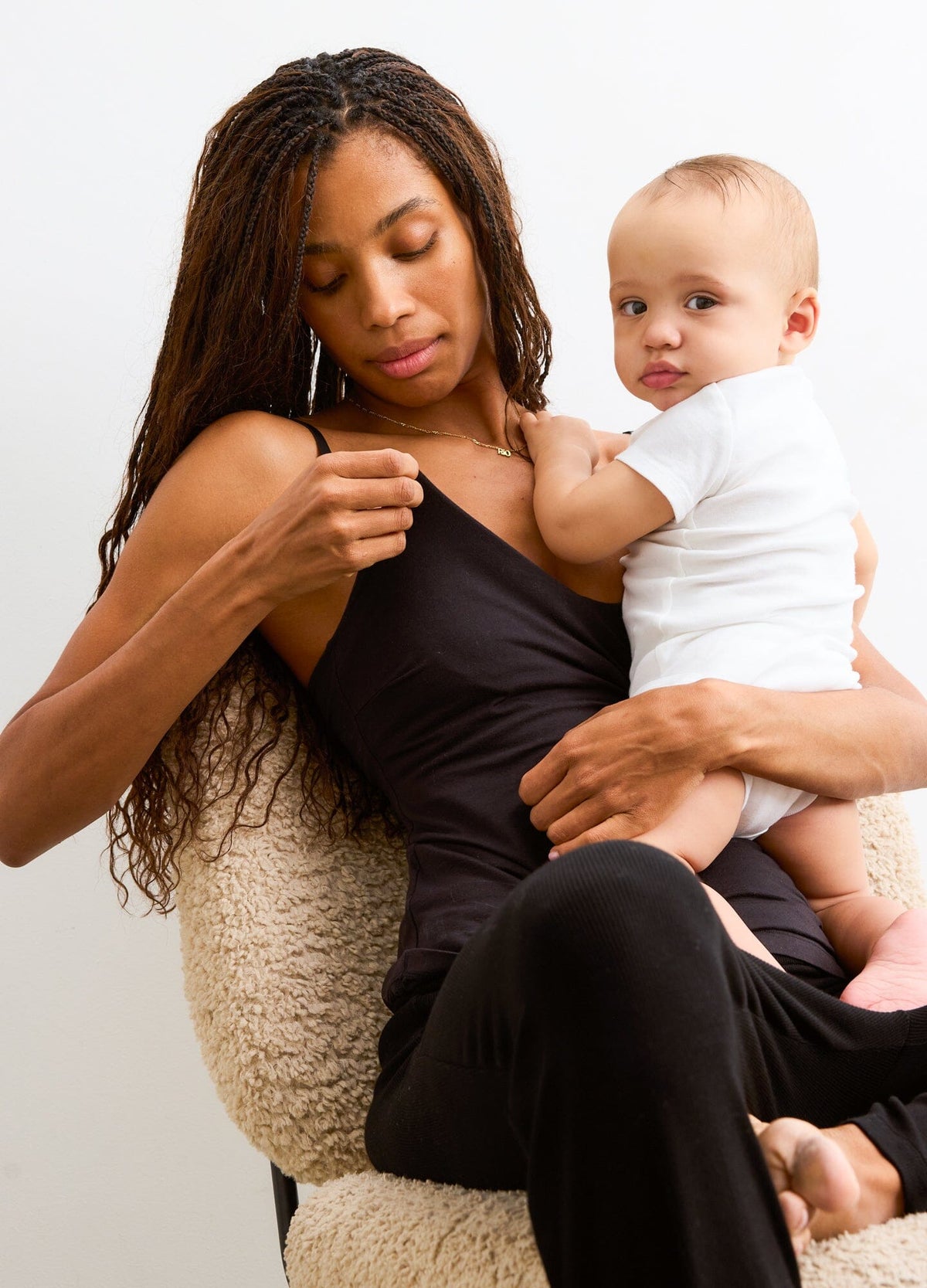 The 24/7 Nursing Tank - Black maternity nursing tank with convenient side access, soft stretch fabric for pregnancy and postpartum comfort.