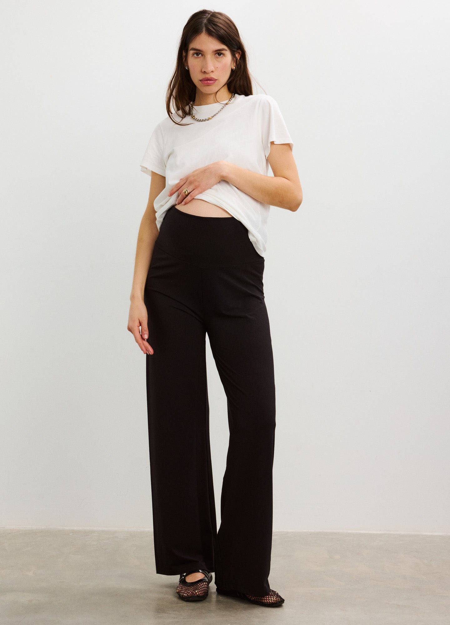 Black maternity lounge pants with wide legs and a high, stretchy waistband designed for comfort during pregnancy.