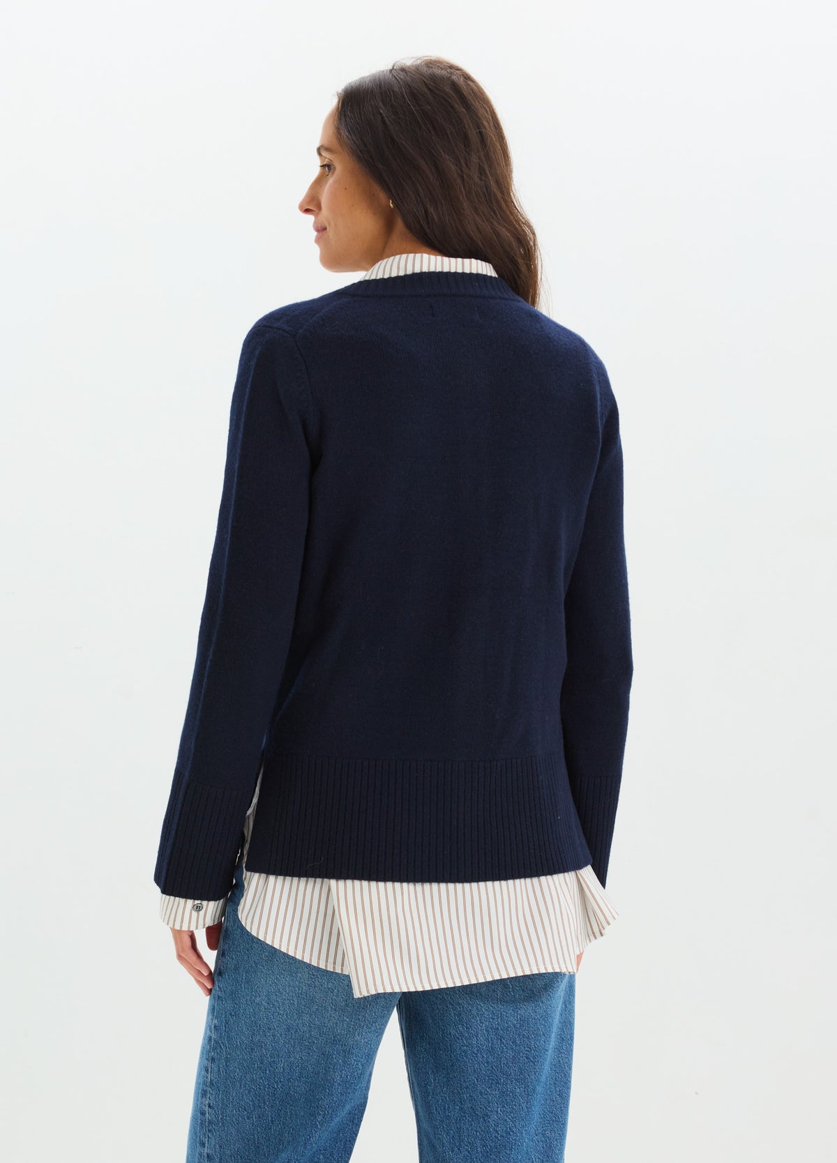 Navy blue maternity cardigan with long sleeves, worn over a white striped shirt, shown from the back.
