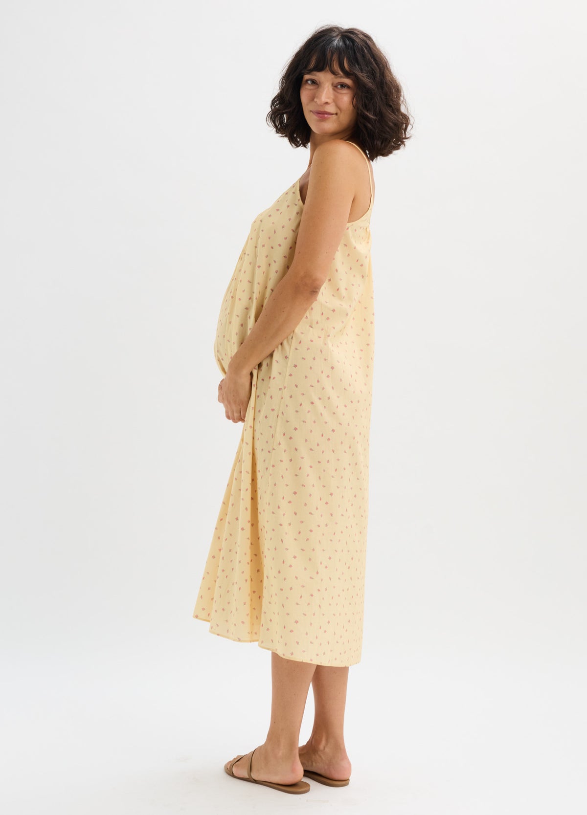 Light yellow sleeveless cotton nursing nightgown with subtle dotted pattern, midi length, relaxed fit.