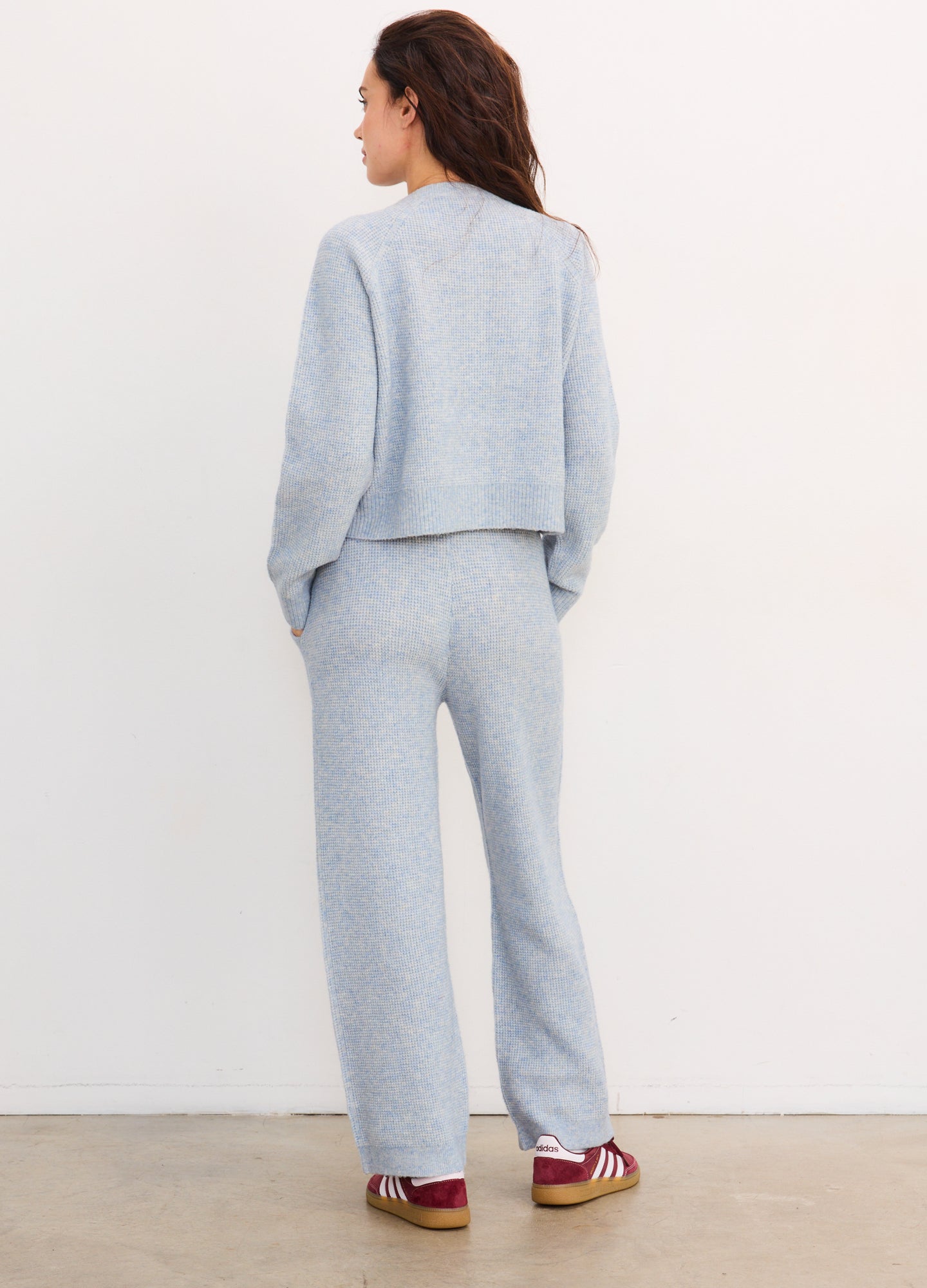 Light blue waffle-knit maternity crop top and matching straight-leg pants set, soft textured fabric.