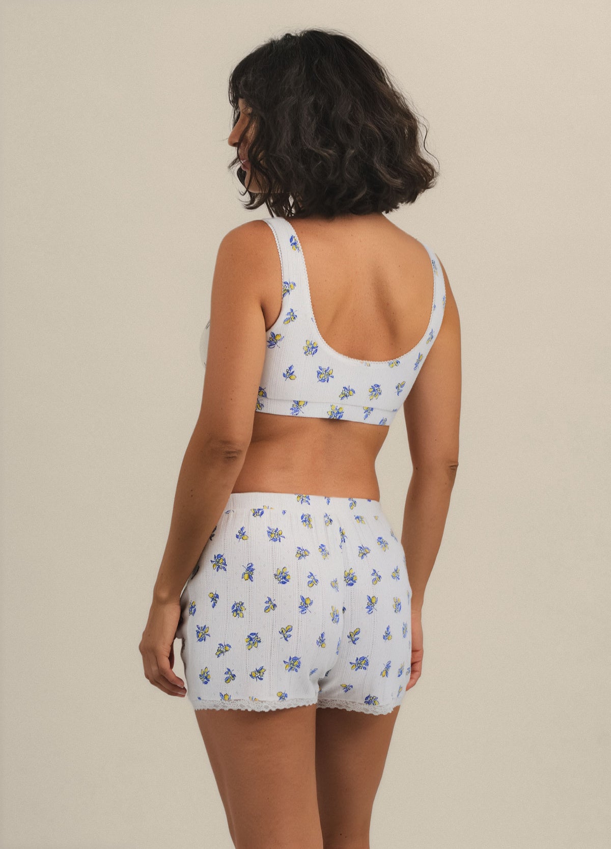 Light blue maternity nursing bra and matching shorts with small floral print, soft fabric.