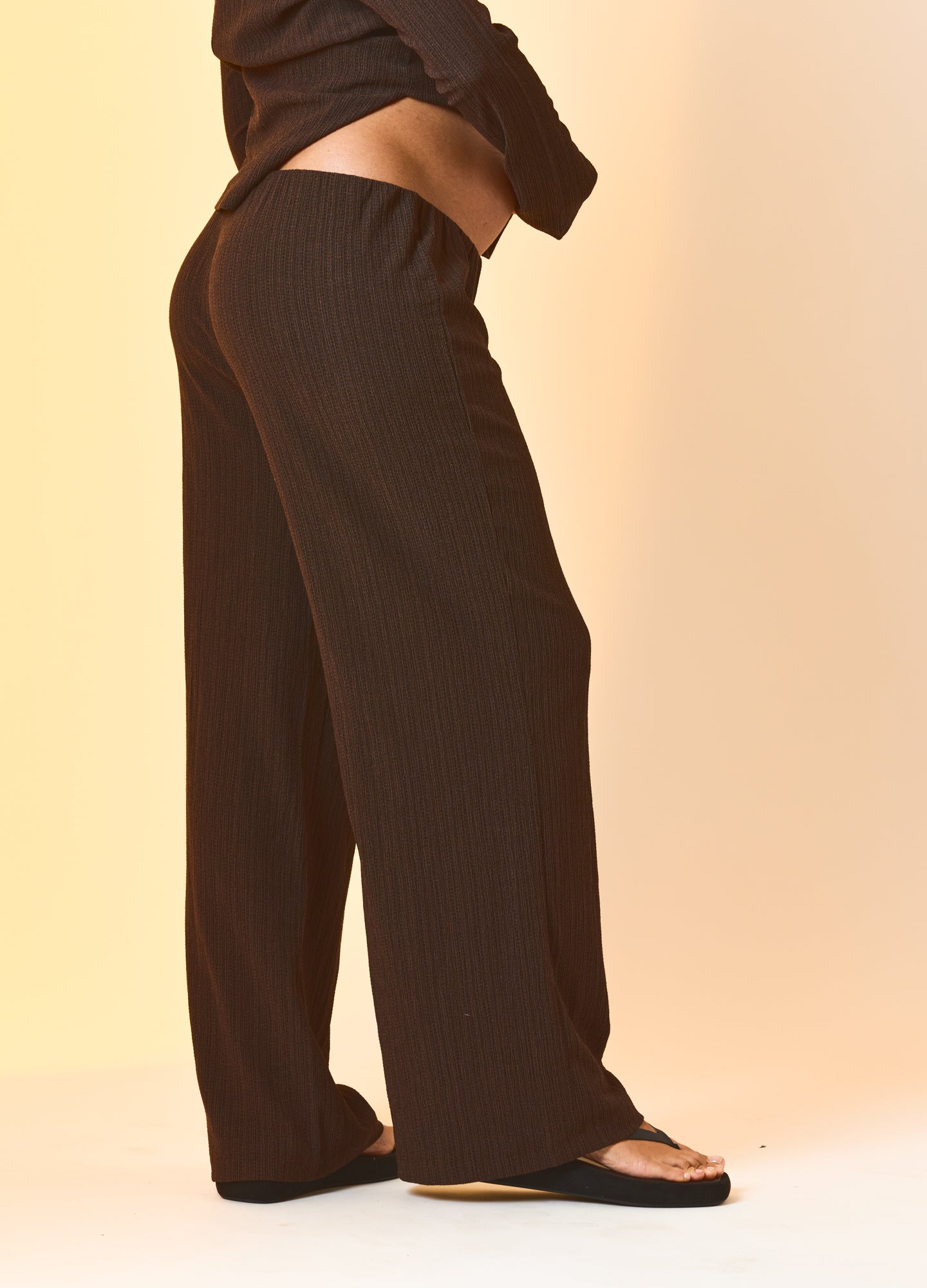 Java-colored maternity pants with wide legs and an elastic waistband fitting a pregnant model.