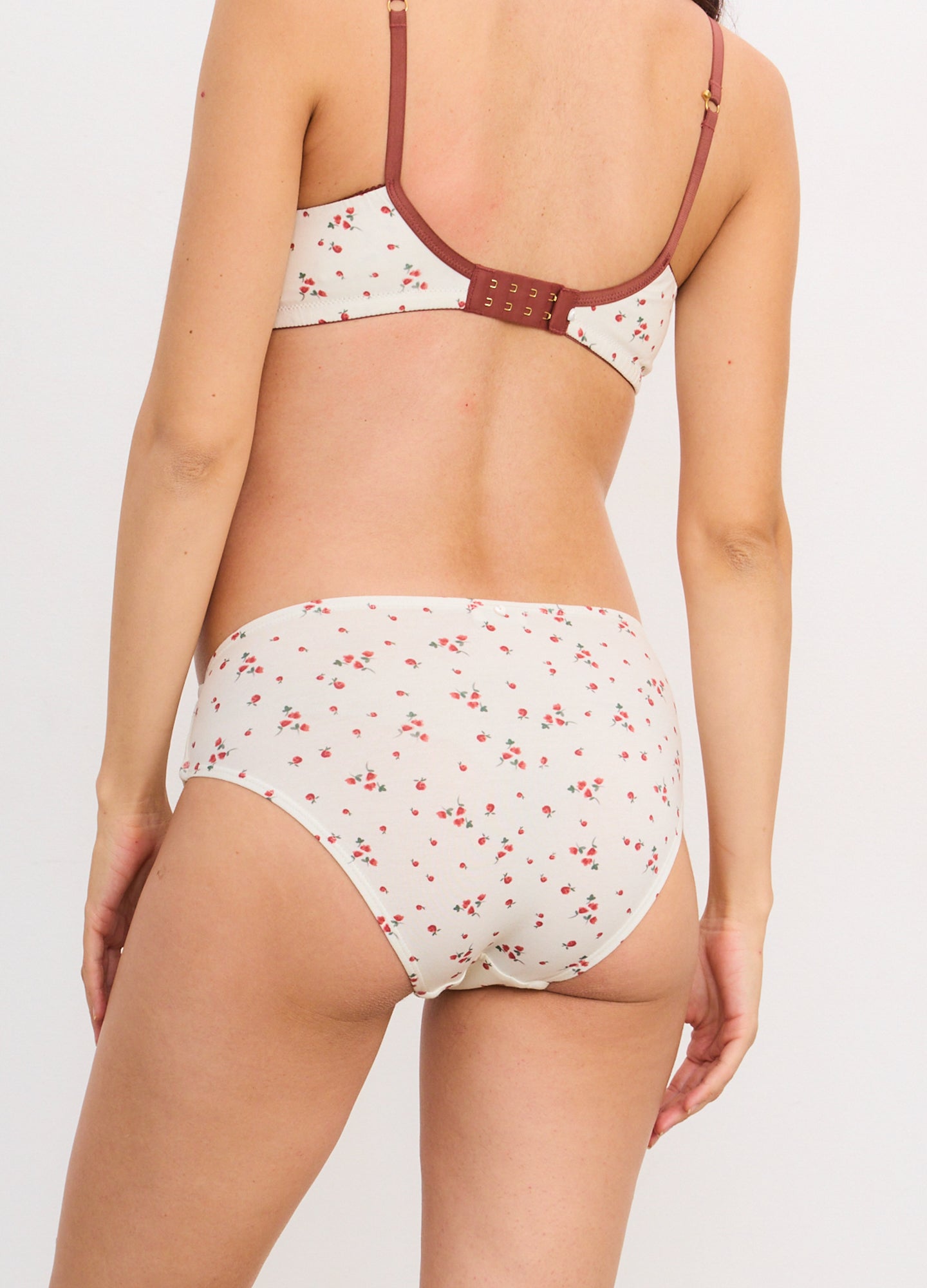 Cream maternity briefs with small red floral print and soft, full coverage design.