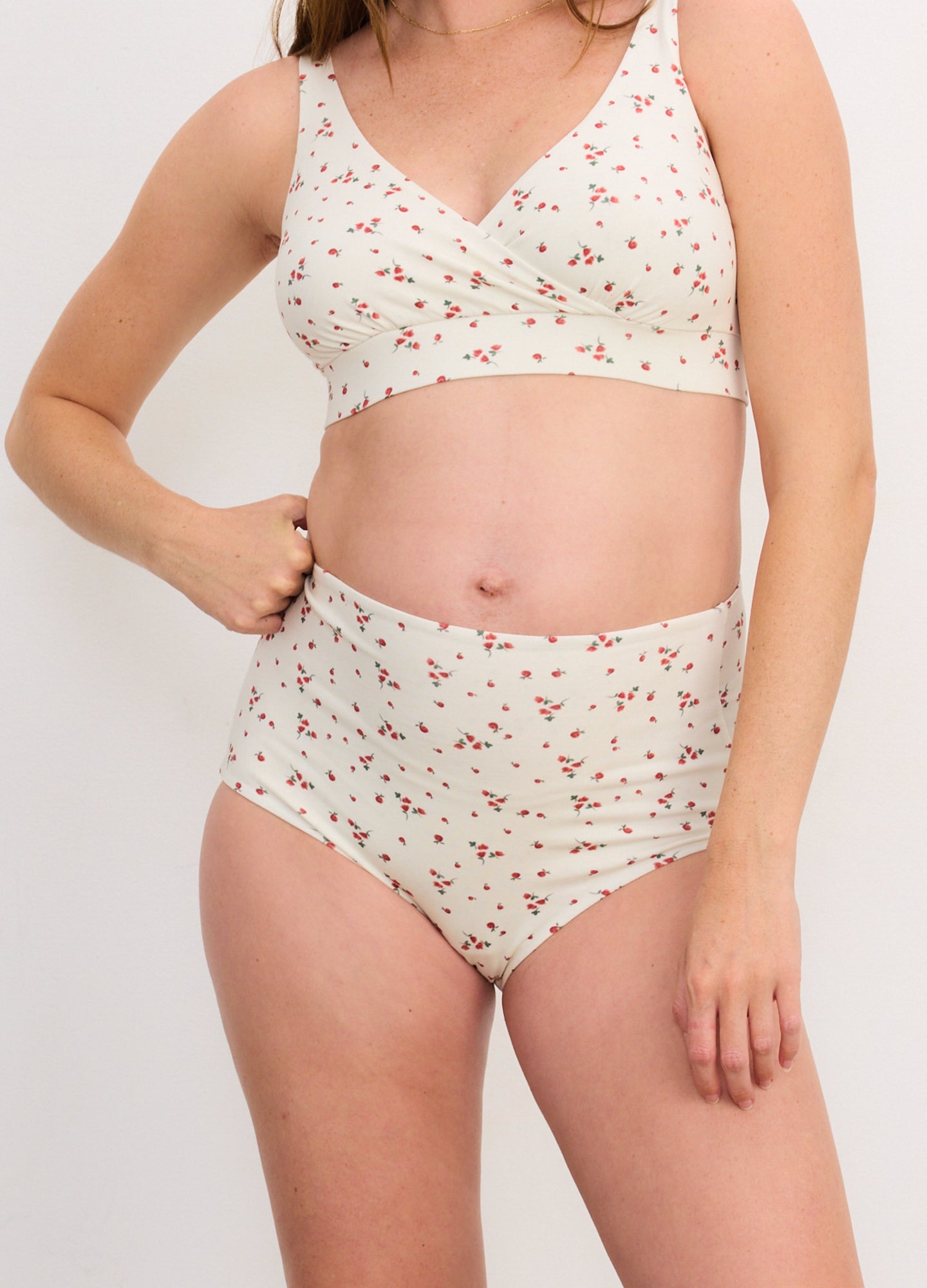 Cream-colored maternity brief with a high waist and small red floral print.