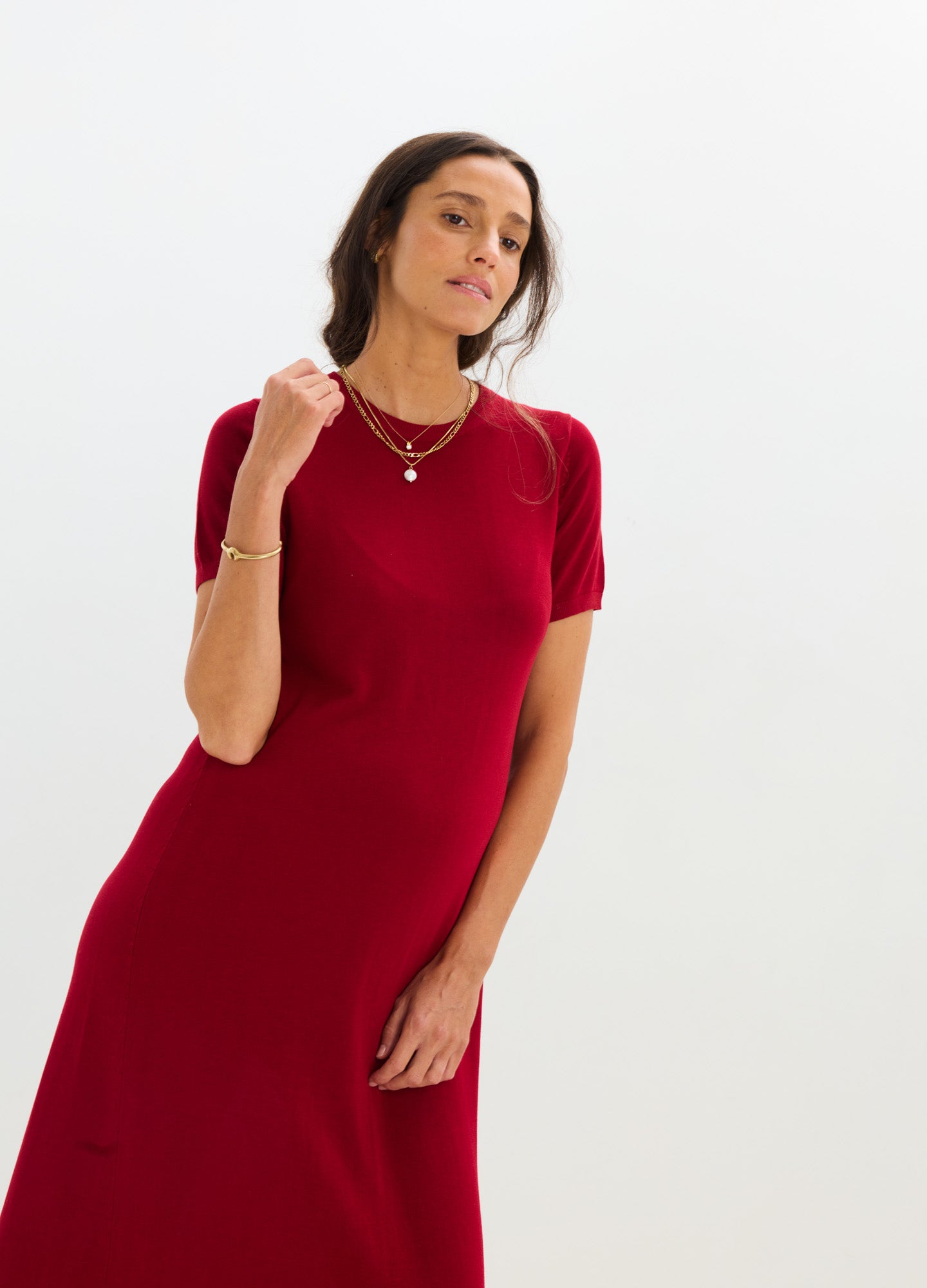 Red knit short-sleeve maternity dress with a fitted silhouette and crew neckline.