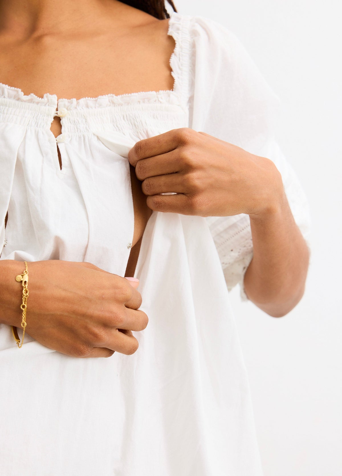 The Lottie Secret Nursing Mini Dress - White nursing mini dress with puff sleeves and delicate lace trim, designed for maternity and postpartum wear.