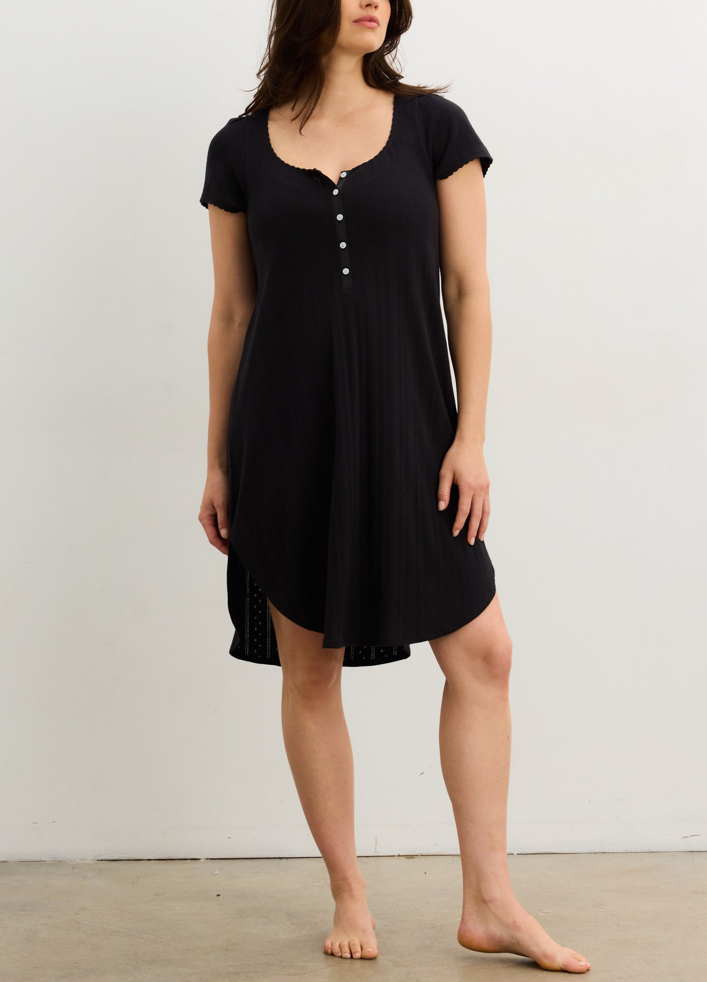 Soft black maternity nightgown with short sleeves, buttoned scoop neckline, and relaxed fit.