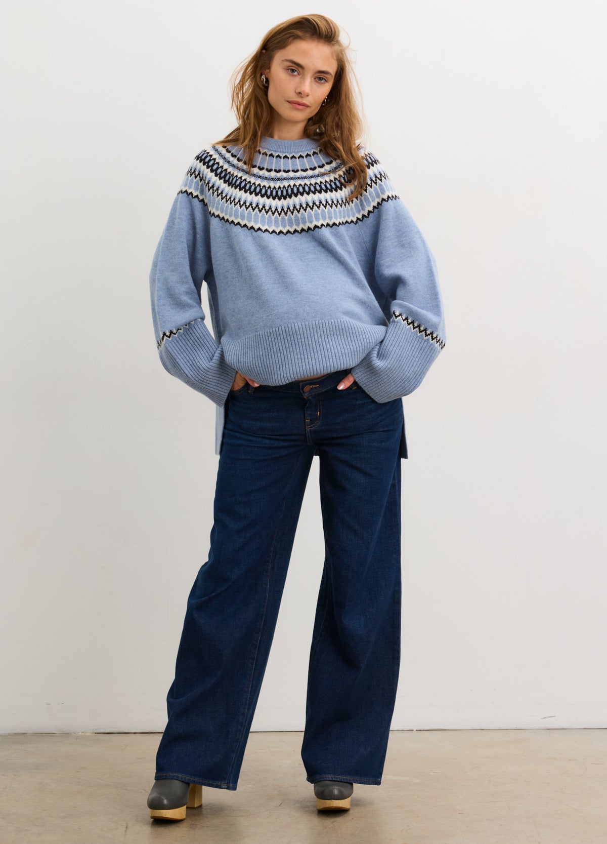 Light blue fair isle pullover with patterned yoke, balloon sleeves, and relaxed fit, styled for maternity wear.