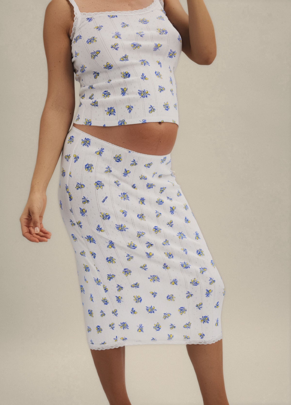 White ribbed maternity cami with blue floral pointelle pattern and matching knee-length skirt.