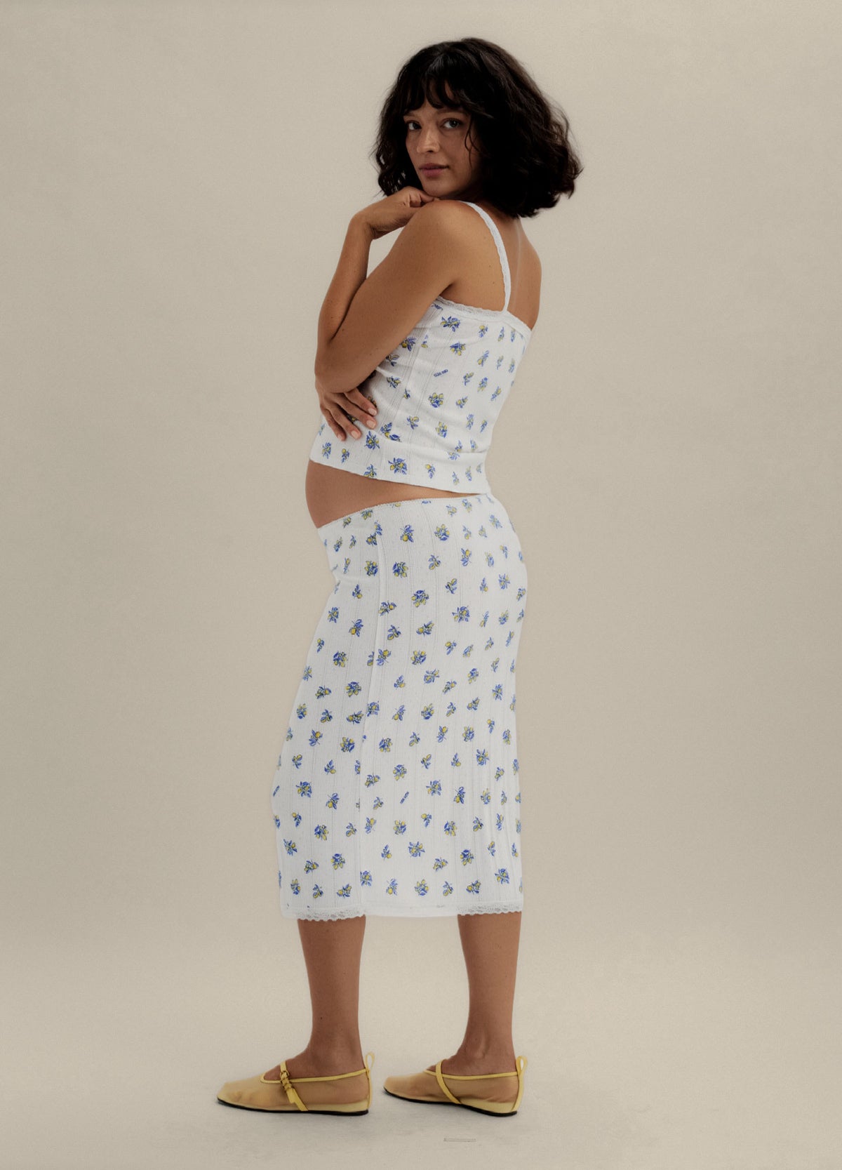 White maternity cami and skirt set with blue floral pointelle pattern, slim fit with adjustable straps.