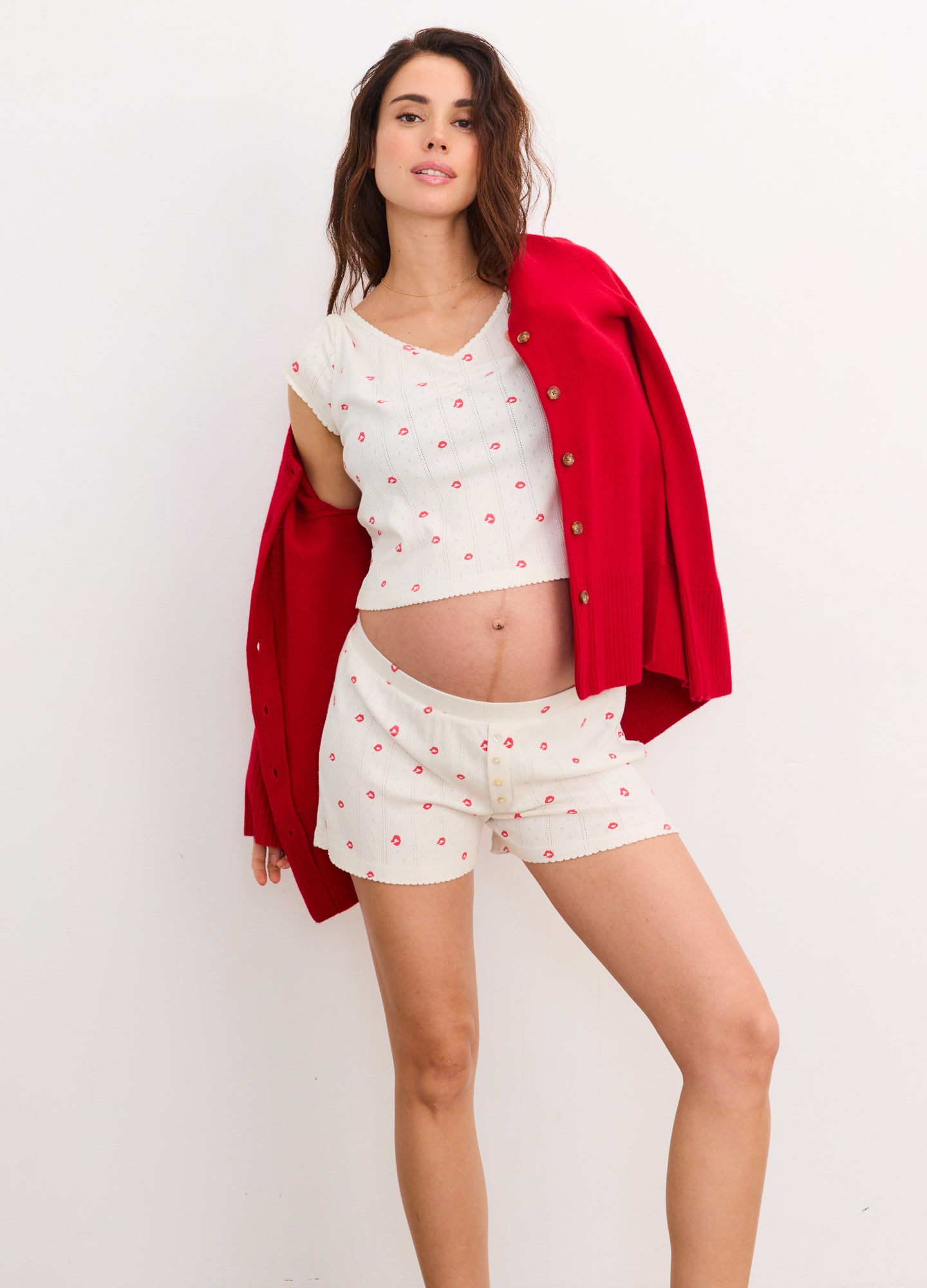 Soft white maternity tee and shorts set with small red heart print, loose fit shorts, and short sleeves.
