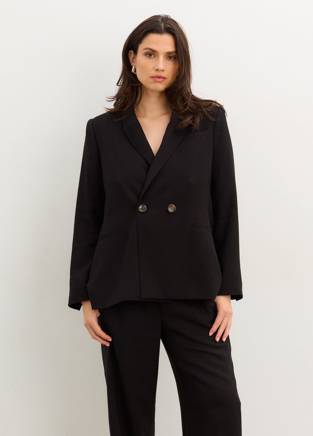 The Soft Tailored Twill Blazer - Black tailored twill blazer with double-button closure, designed for maternity, nursing, and postpartum wear.
