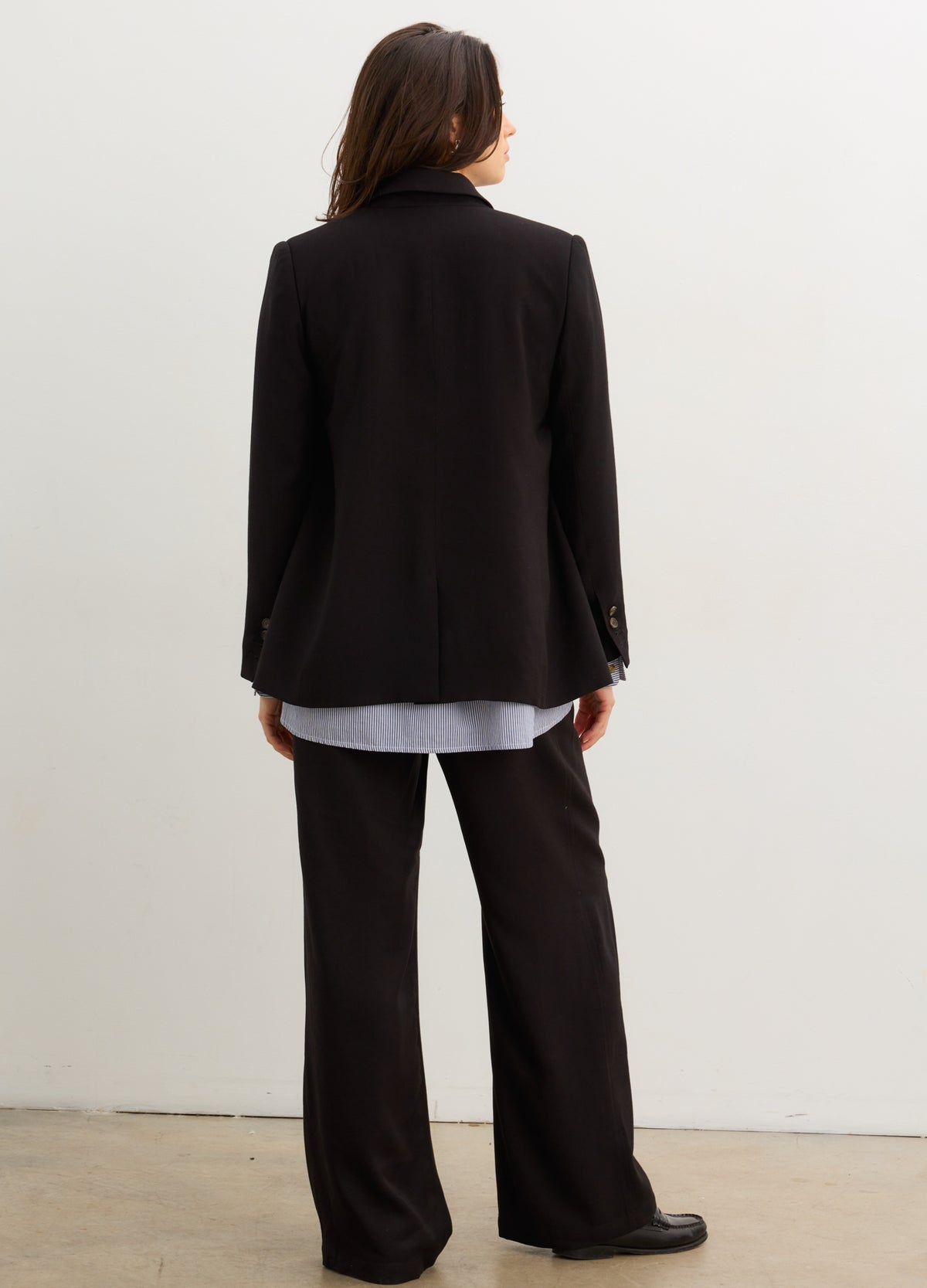 The Soft Tailored Twill Blazer - Black tailored twill blazer with double-button closure, designed for maternity, nursing, and postpartum wear.