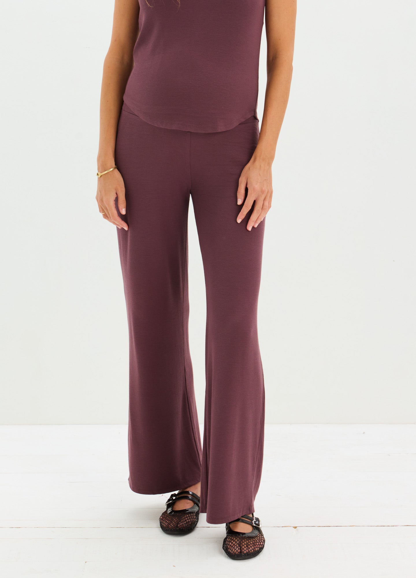 Maternity ribbed relaxed pants in deep plum with wide legs and a high waistband designed for comfort.