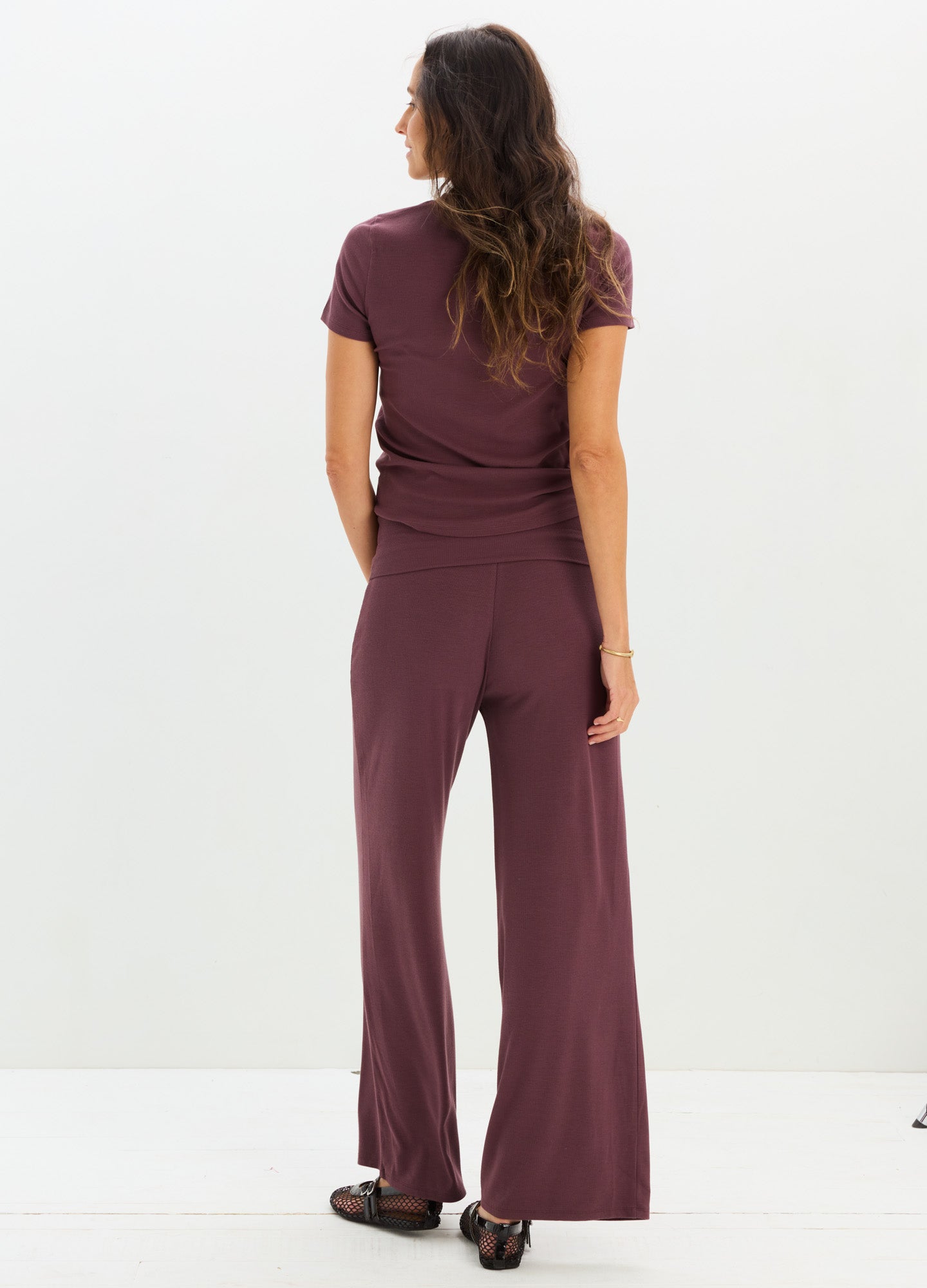 Mauve ribbed maternity pants with relaxed wide legs and adjustable over-under waistband.