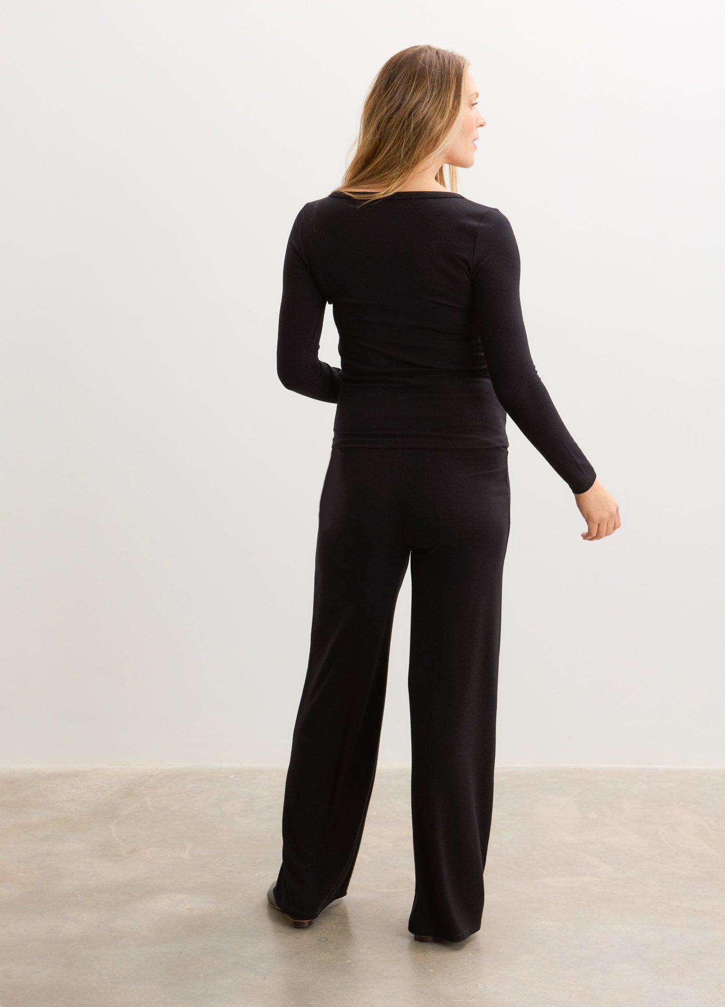 Black ribbed long-sleeve nursing cardigan with matching wide-leg pants, soft knit fabric.
