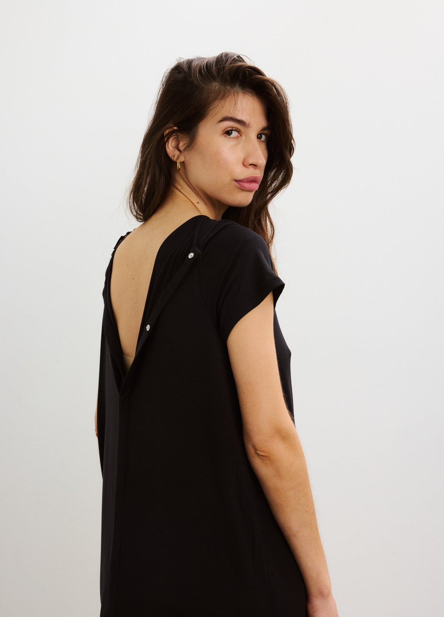 Black maternity nightgown with soft fabric, short sleeves, and deep V-back with button details.