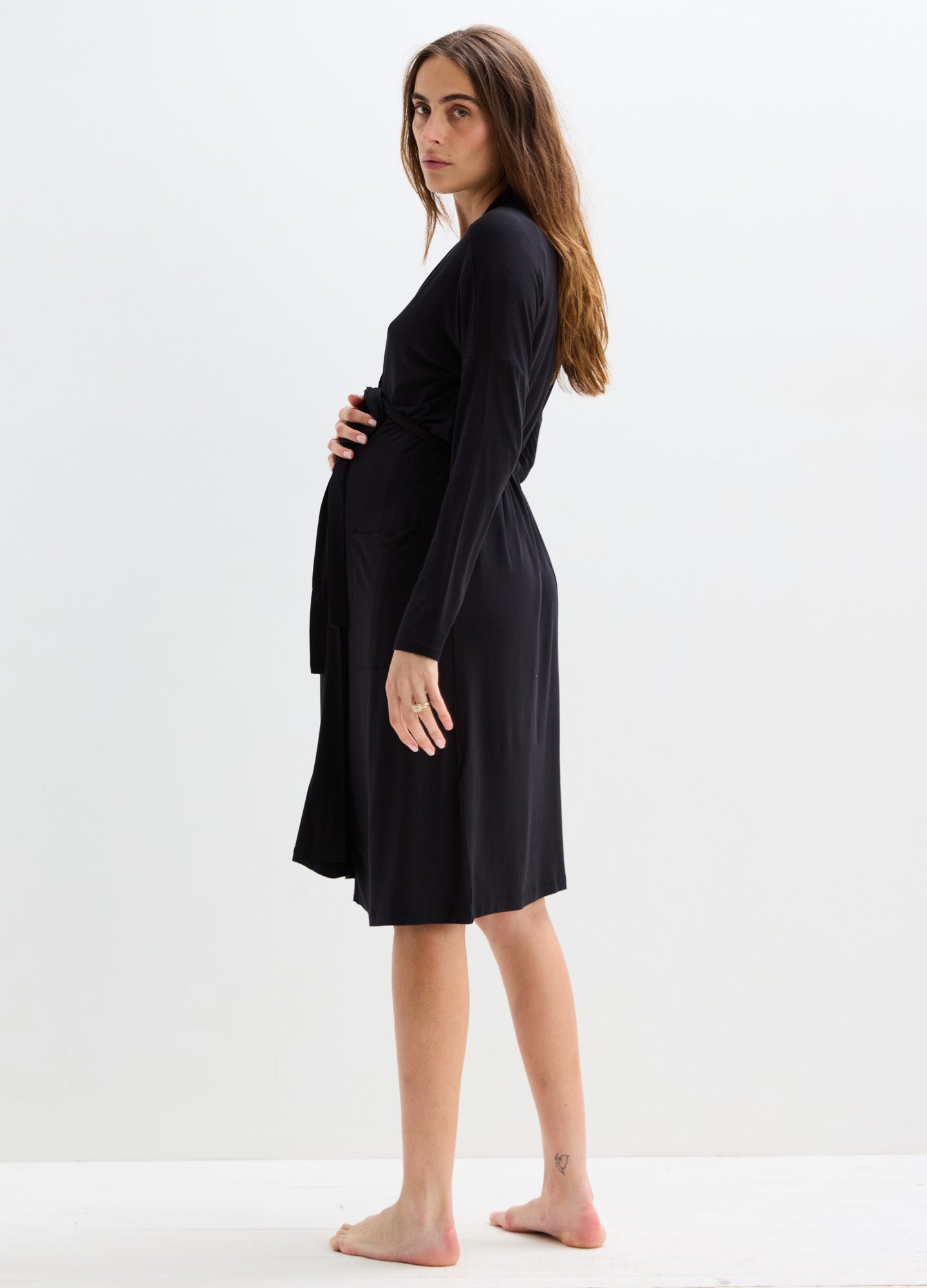 Black knee-length maternity robe with long sleeves and a soft, flowing fabric fit for pregnancy.
