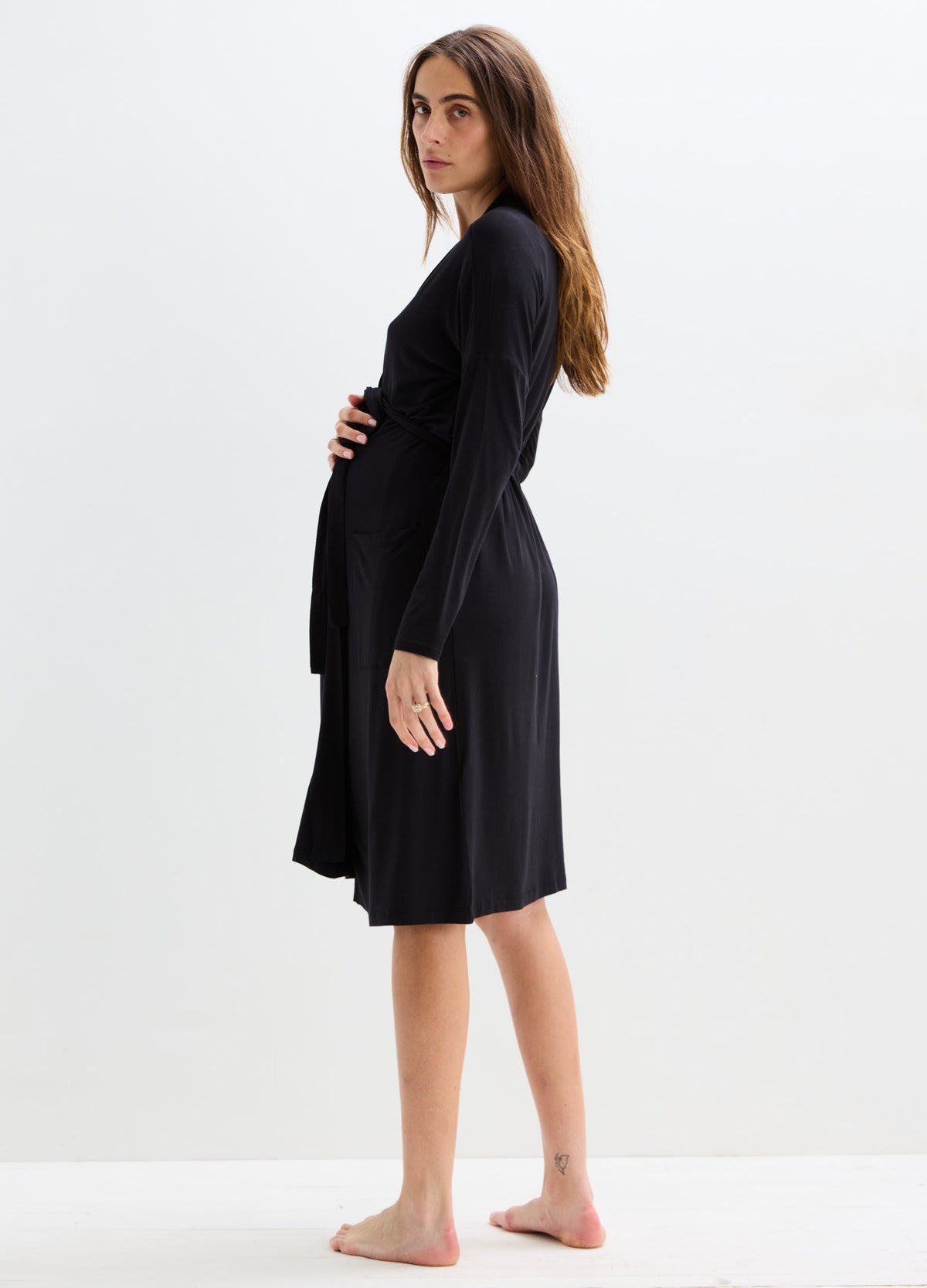 Black knee-length maternity robe with long sleeves and a soft, flowing fabric fit for pregnancy.