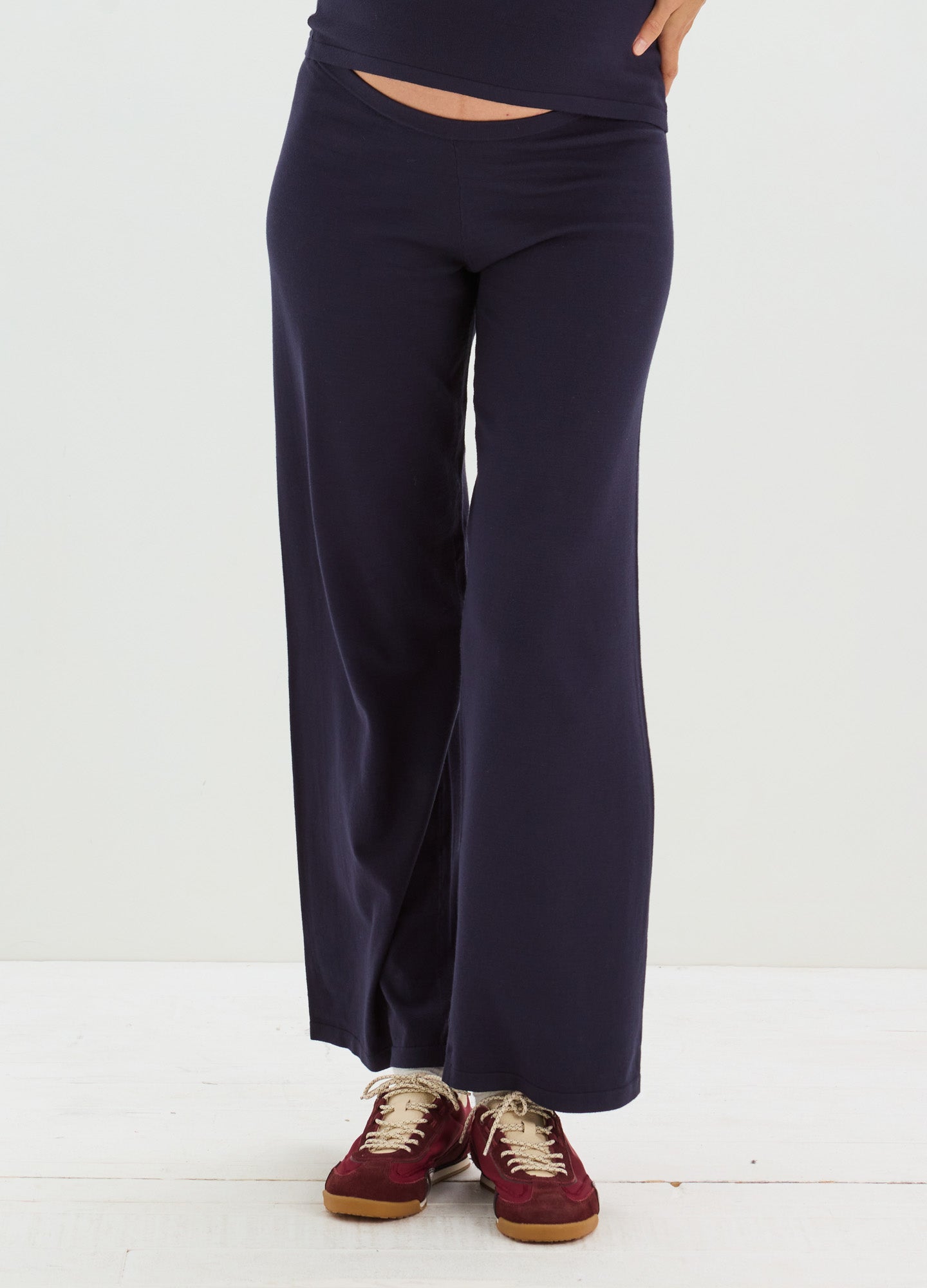 Navy blue wide-leg maternity pants with a soft, stretchy waistband designed for pregnant women.