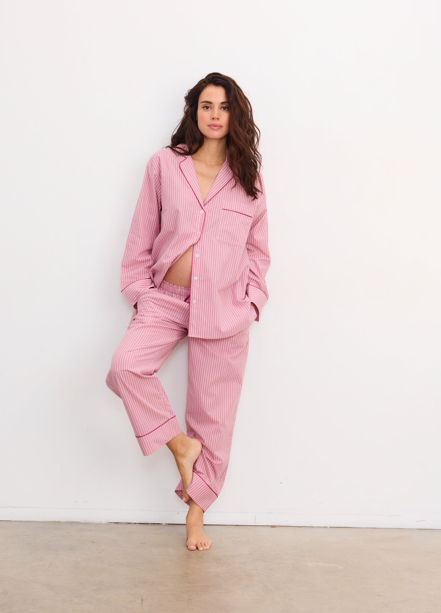 Soft pink striped cotton maternity pajama set with button-up top and relaxed pants.