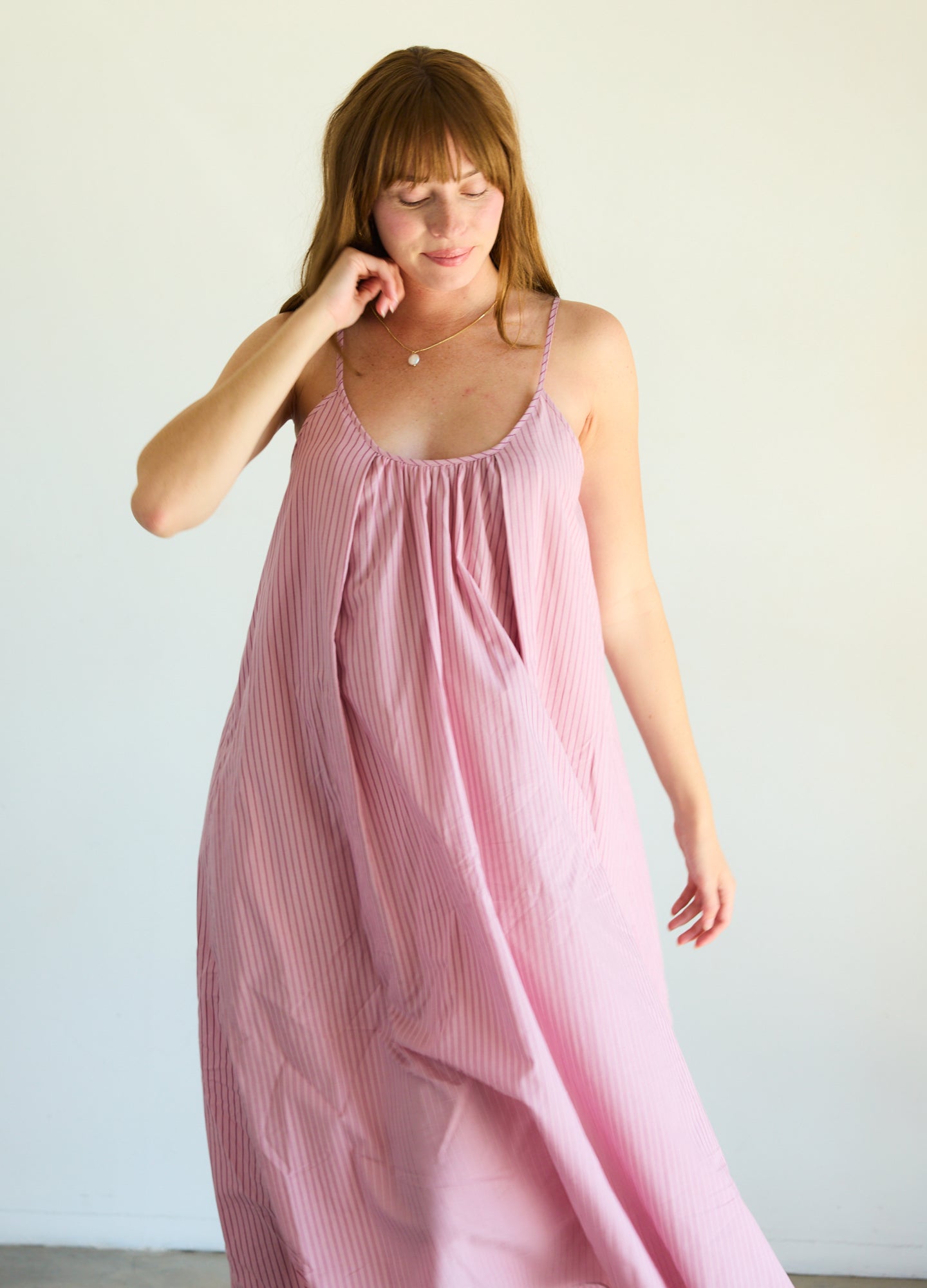 Soft pink striped cotton nursing nightgown with adjustable spaghetti straps and loose maternity fit.