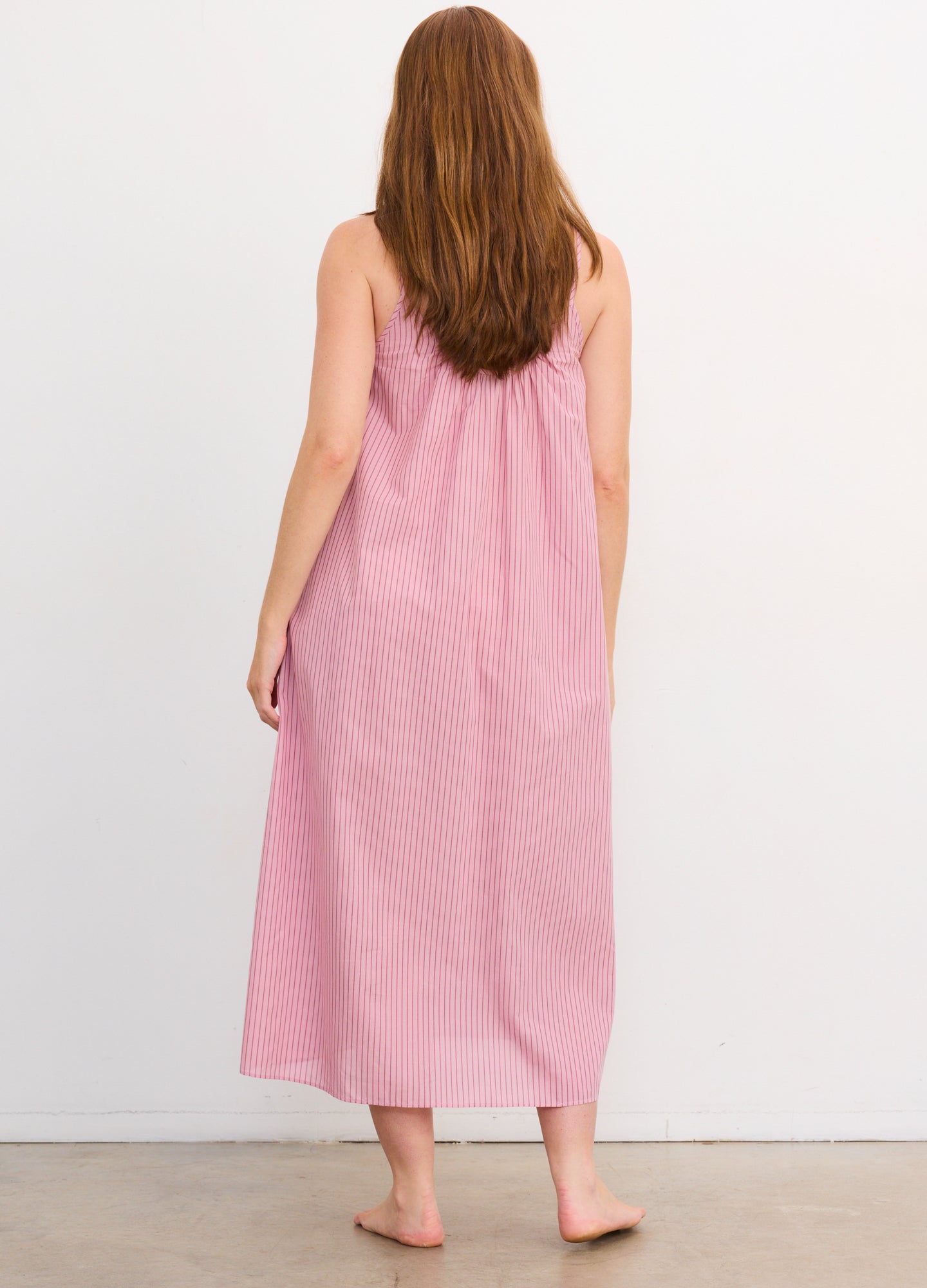 Pink striped sleeveless cotton nursing nightgown with loose fit, midi length, and gathered back detail.