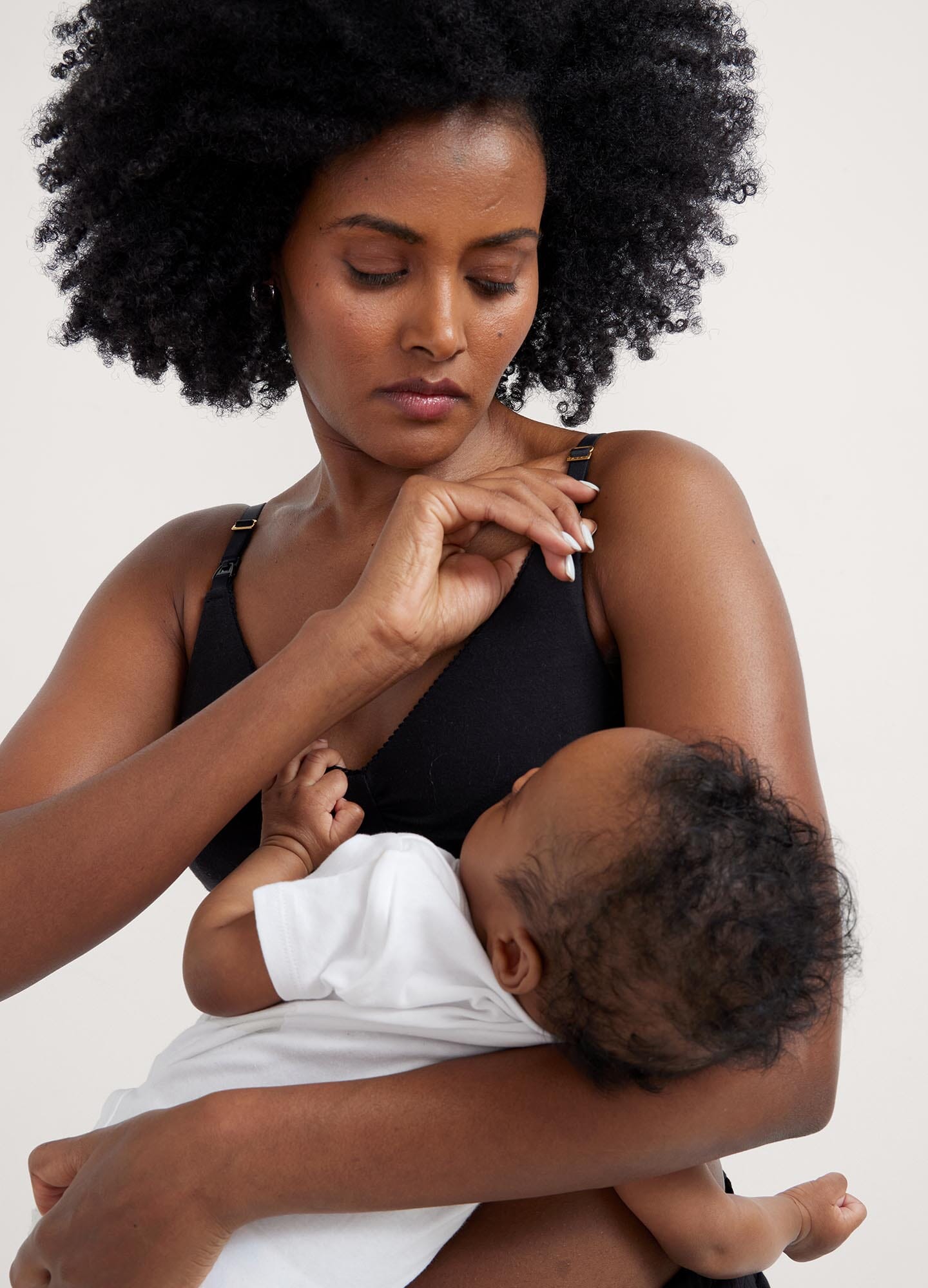 The Everyday Nursing Bra - Black maternity nursing bra with adjustable straps designed for pregnancy and postpartum comfort.