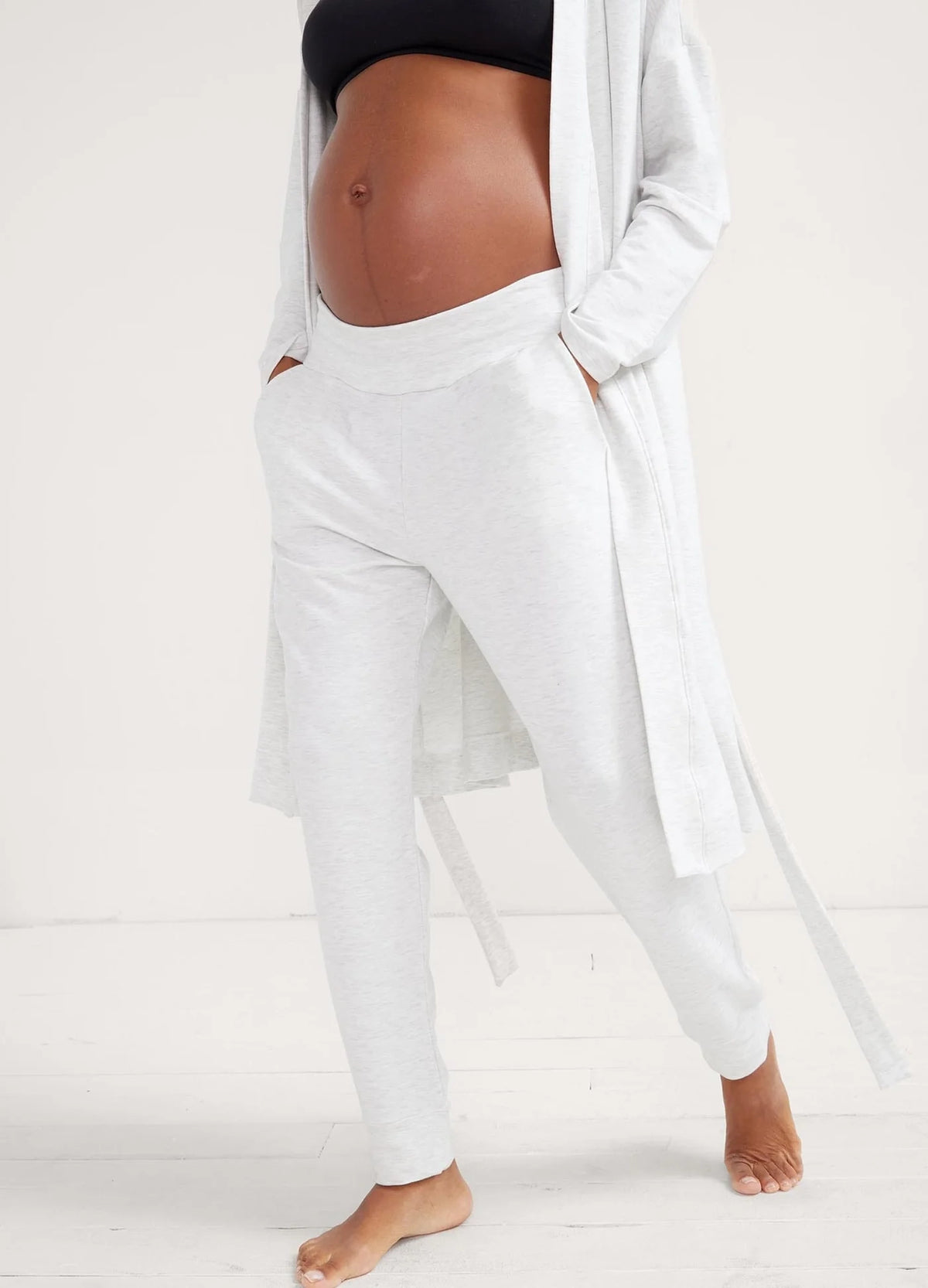 Light grey soft knit joggers with maternity waistband and tapered ankles, styled with a matching robe.
