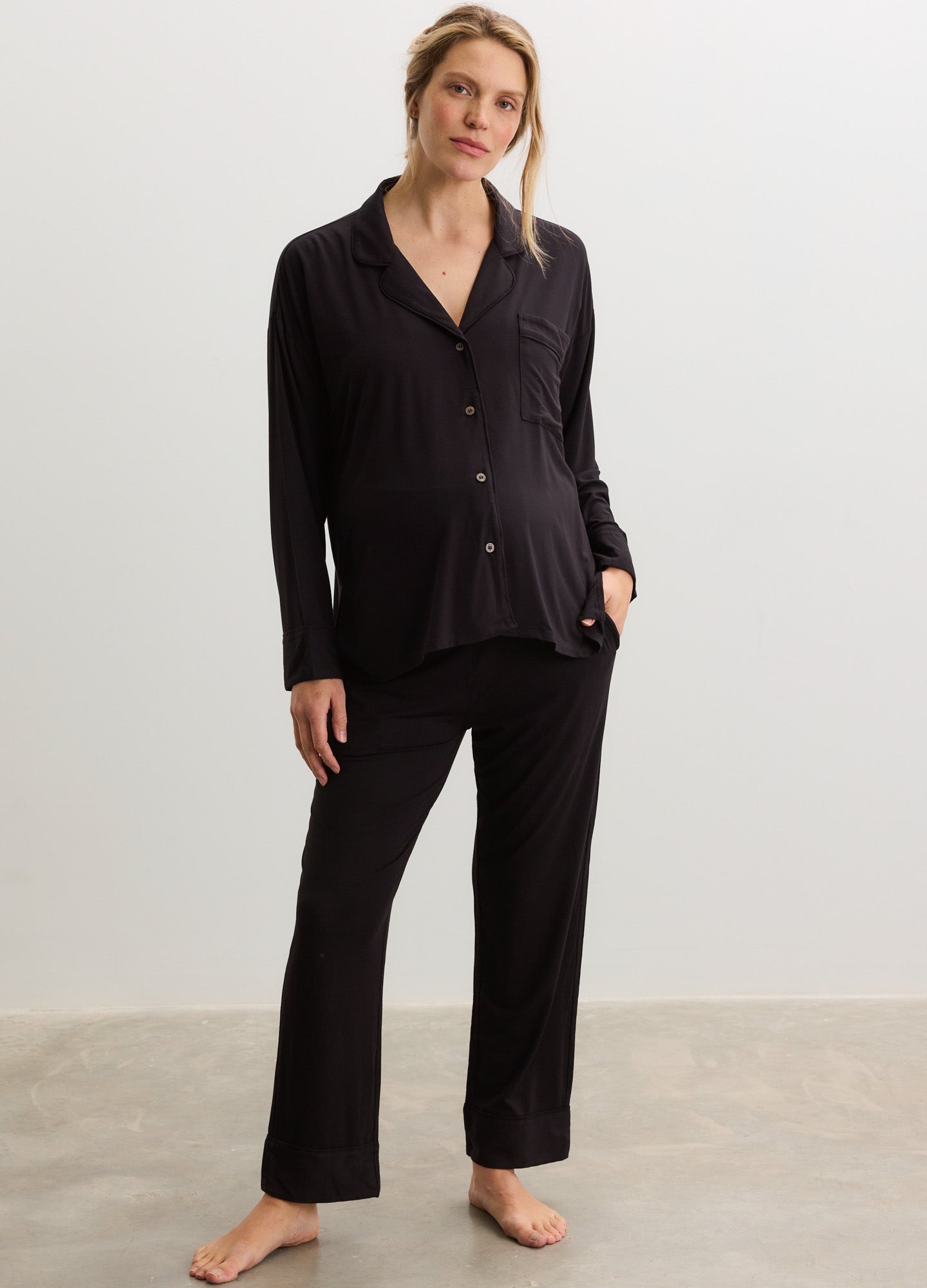 Black long-sleeve maternity pajama top with buttons and matching soft lounge pants.
