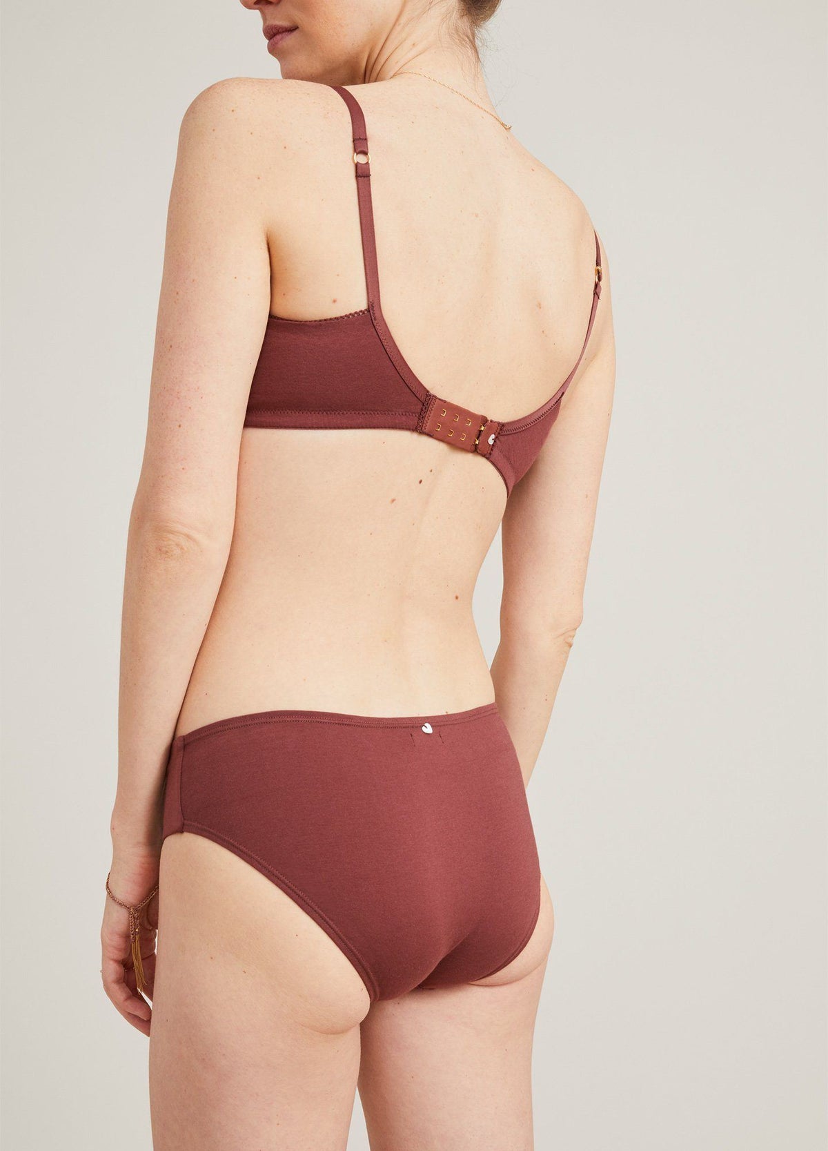 The Everyday Brief - Soft seamless maternity nursing bra and matching briefs in warm anise color designed for pregnancy and postpartum comfort.