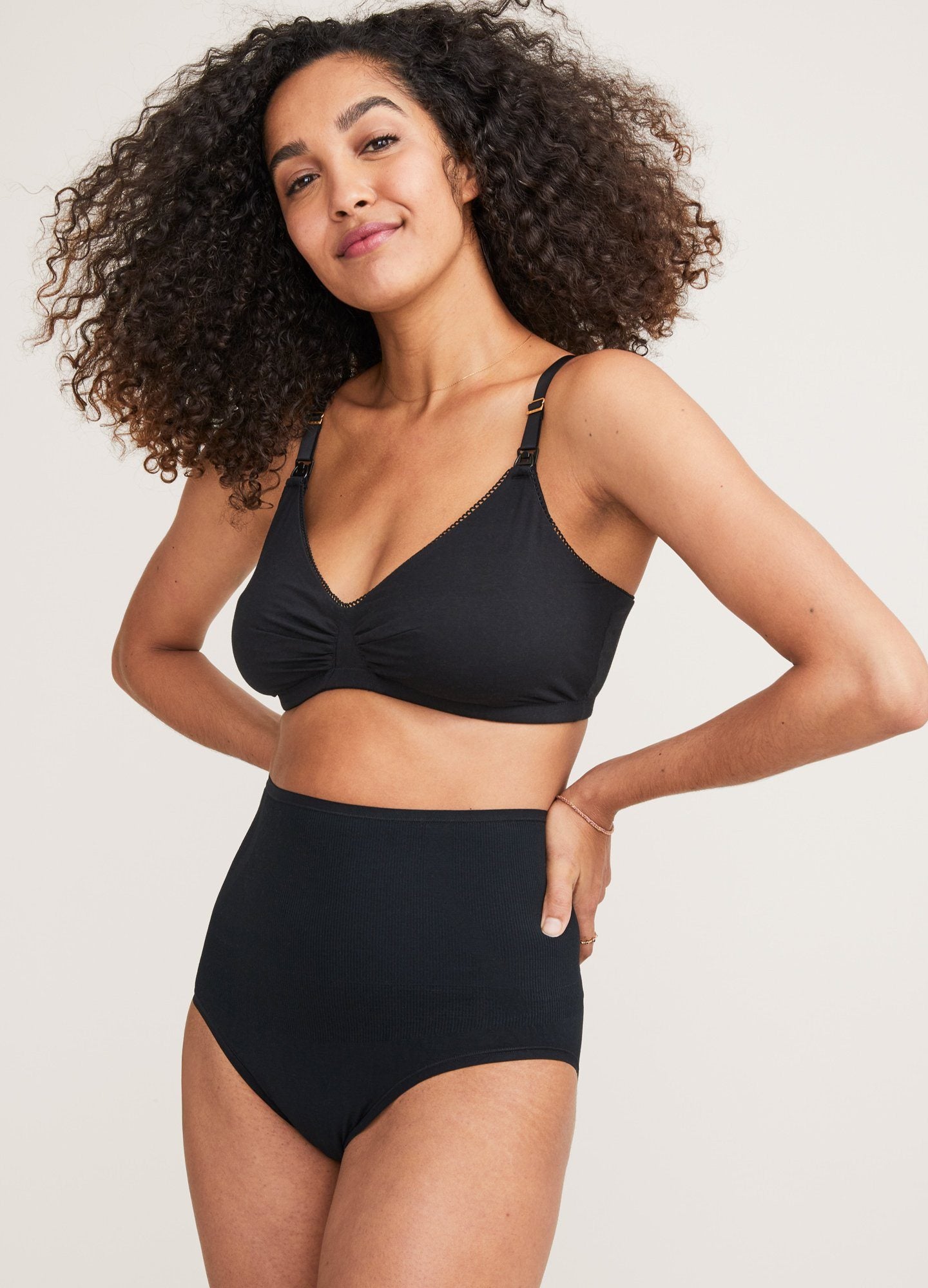The Everyday Nursing Bra - Black maternity nursing bra with adjustable straps designed for pregnancy and postpartum comfort.